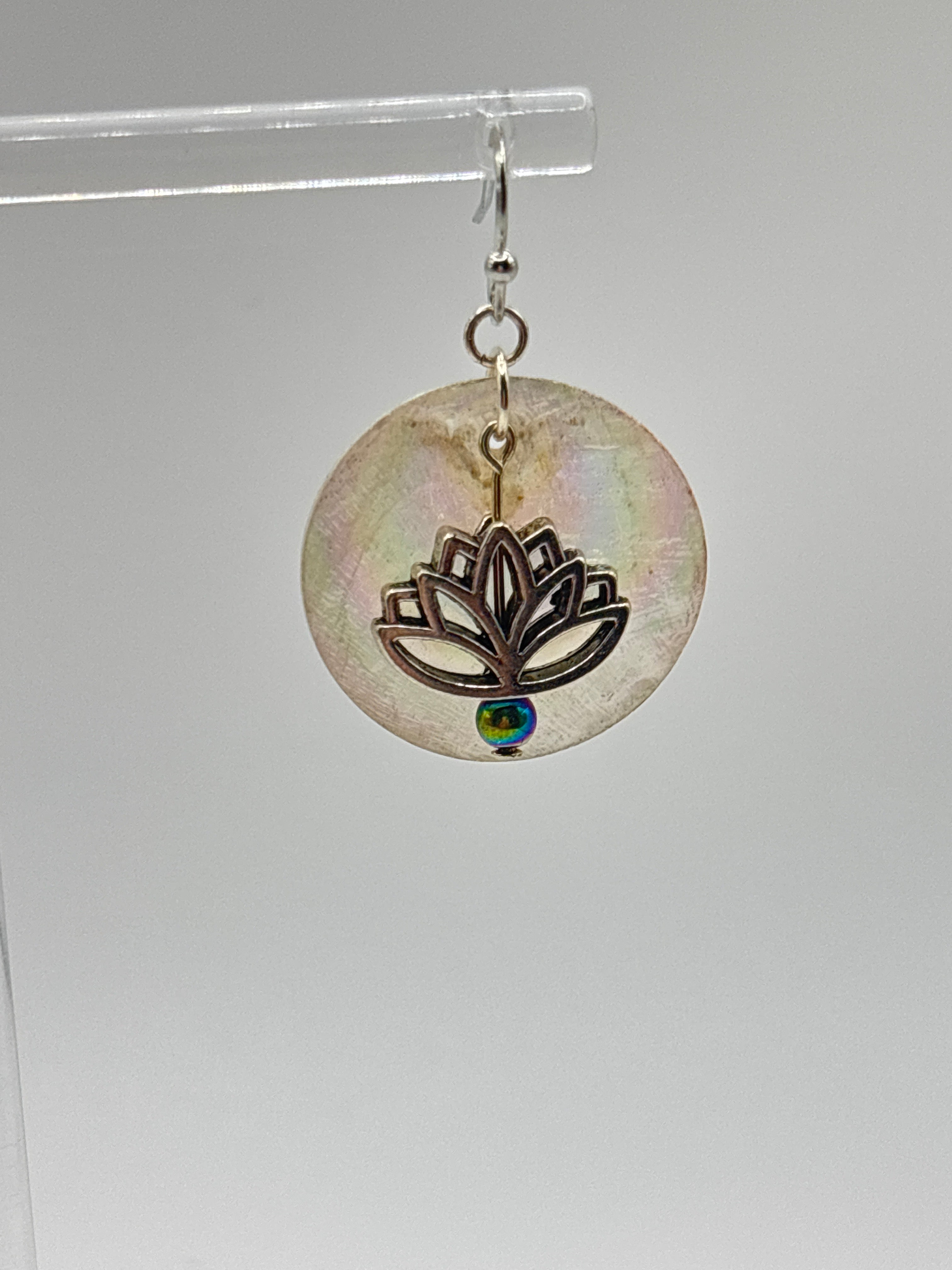 Silver tone lotus flower on iridescent shell
