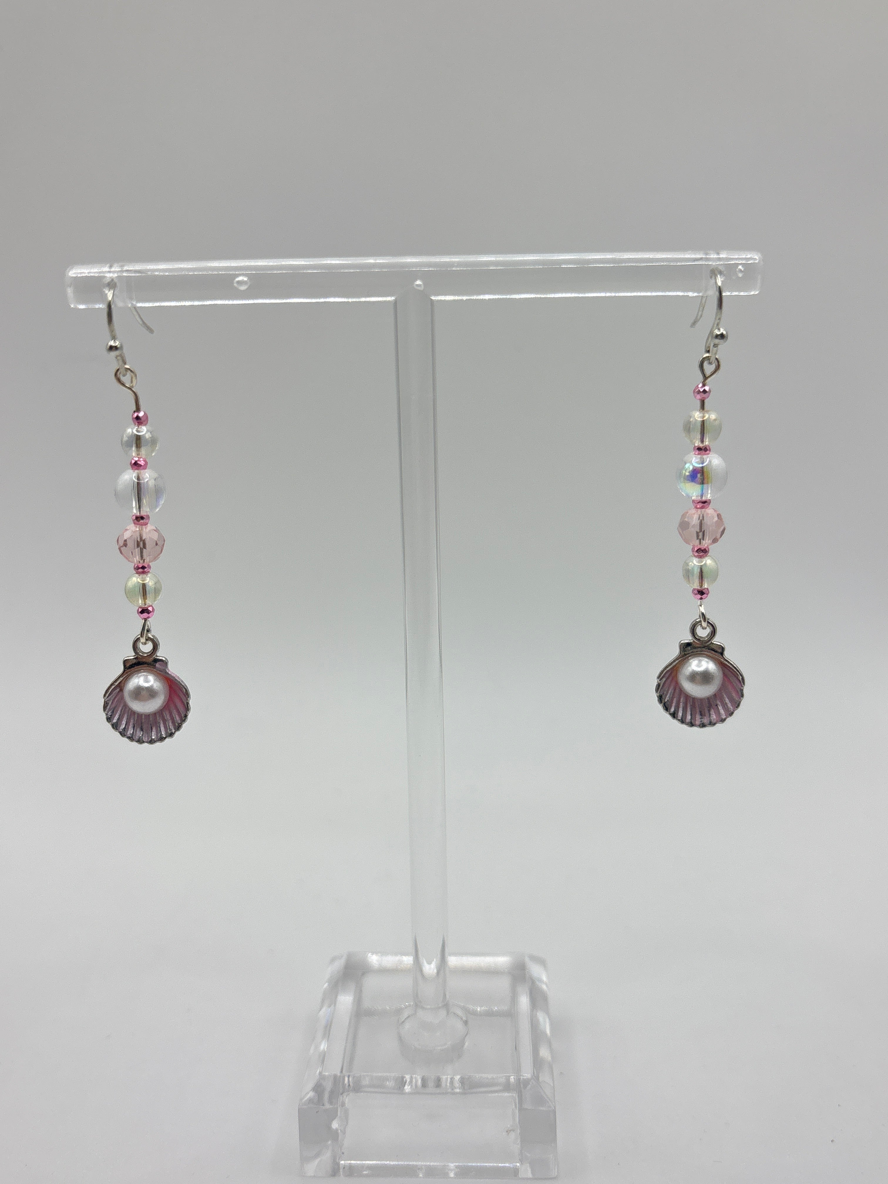 Pink shell with silver tone, pearl, bubbles and crystal.