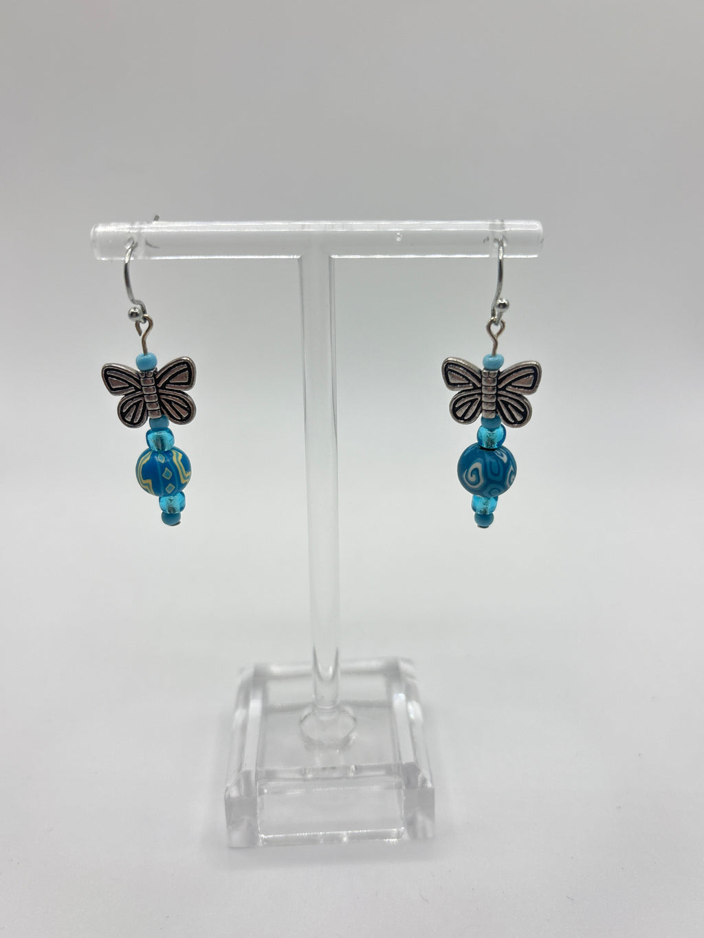 Silver tone butterfly with blue beads