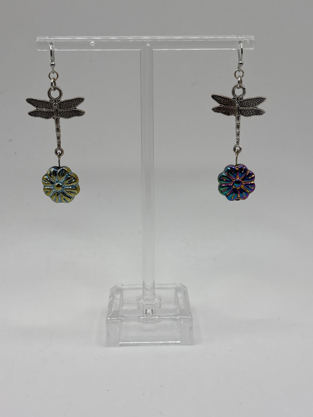 Silver tone dragonfly with iridescent flower