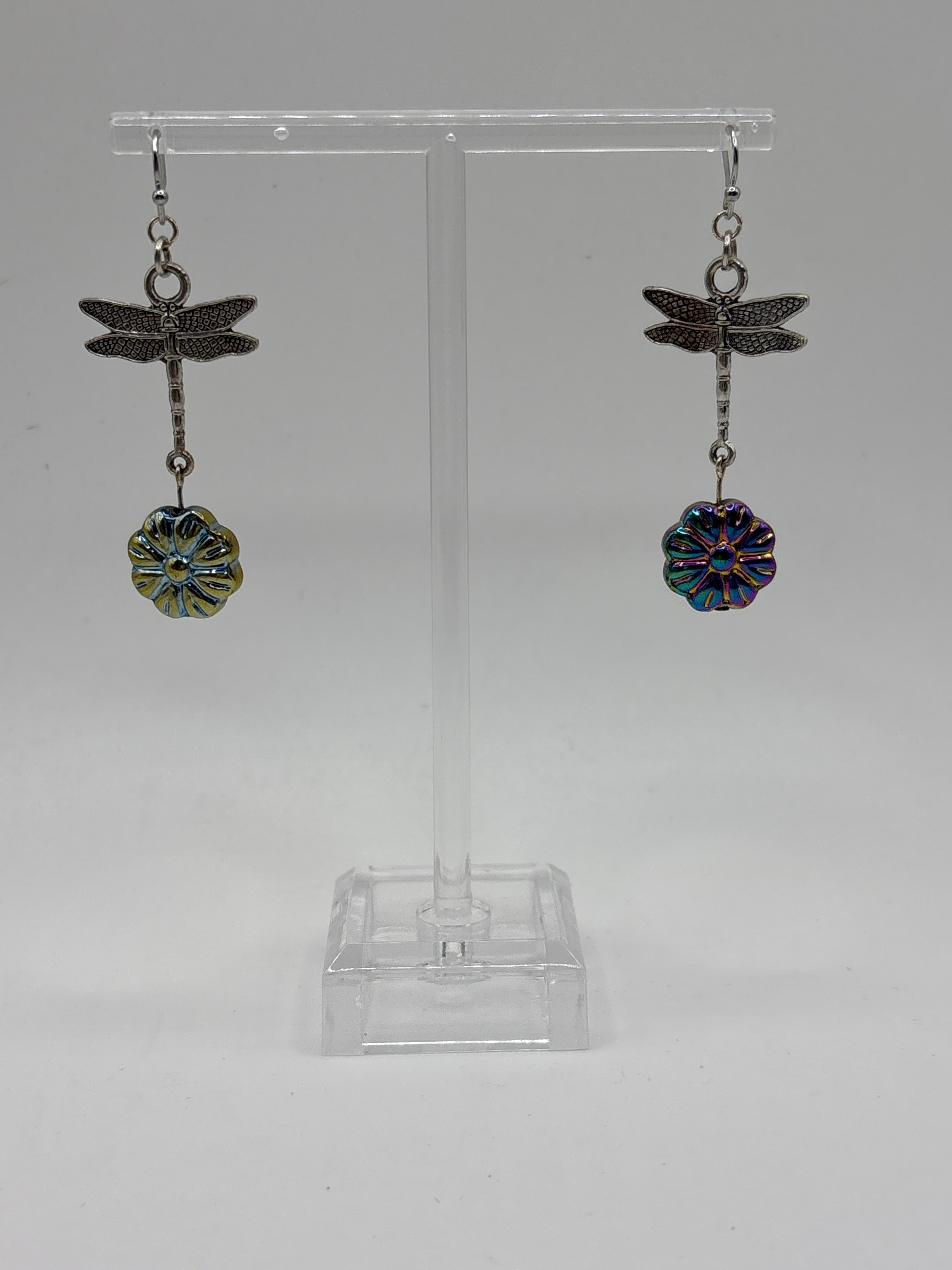 Silver tone dragonfly with iridescent flower