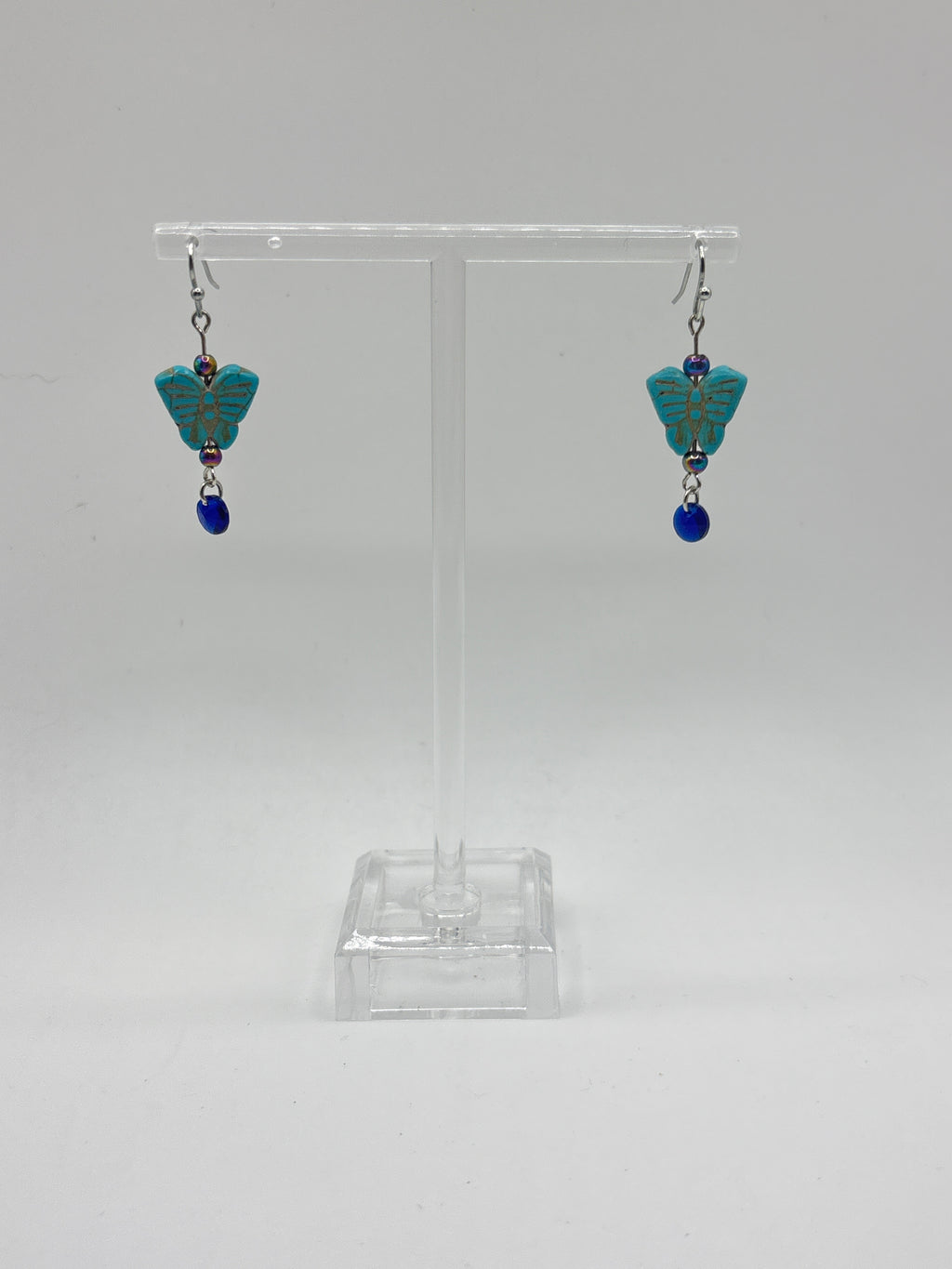 Turquoise small butterfly with iridescent bead