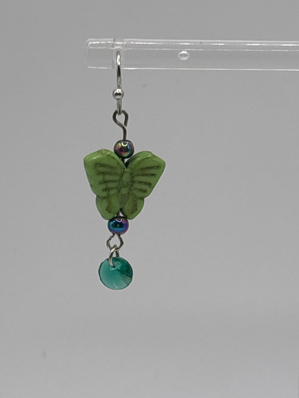 Green butterfly with green dangle