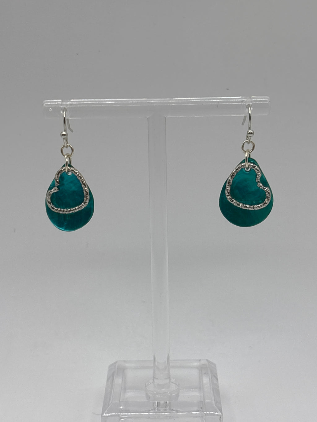 Ocean blue shell teardrop with silver tone braided heart