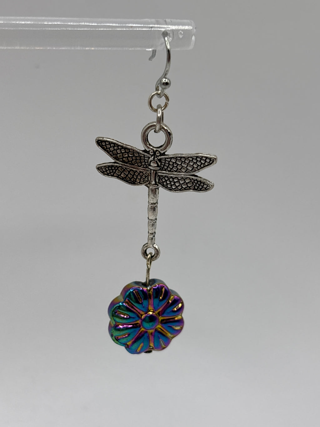 Silver tone dragonfly with iridescent flower