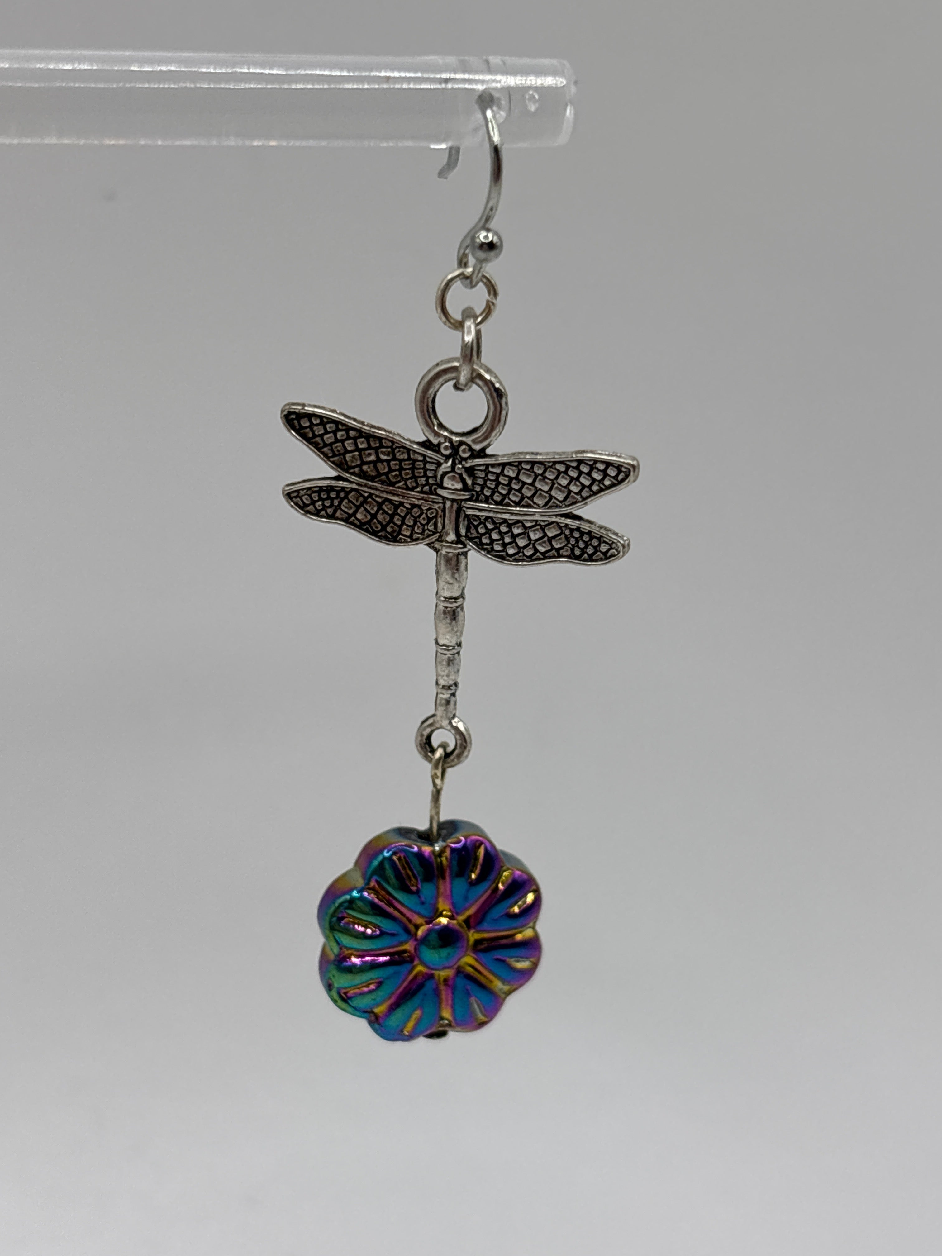 Silver tone dragonfly with iridescent flower