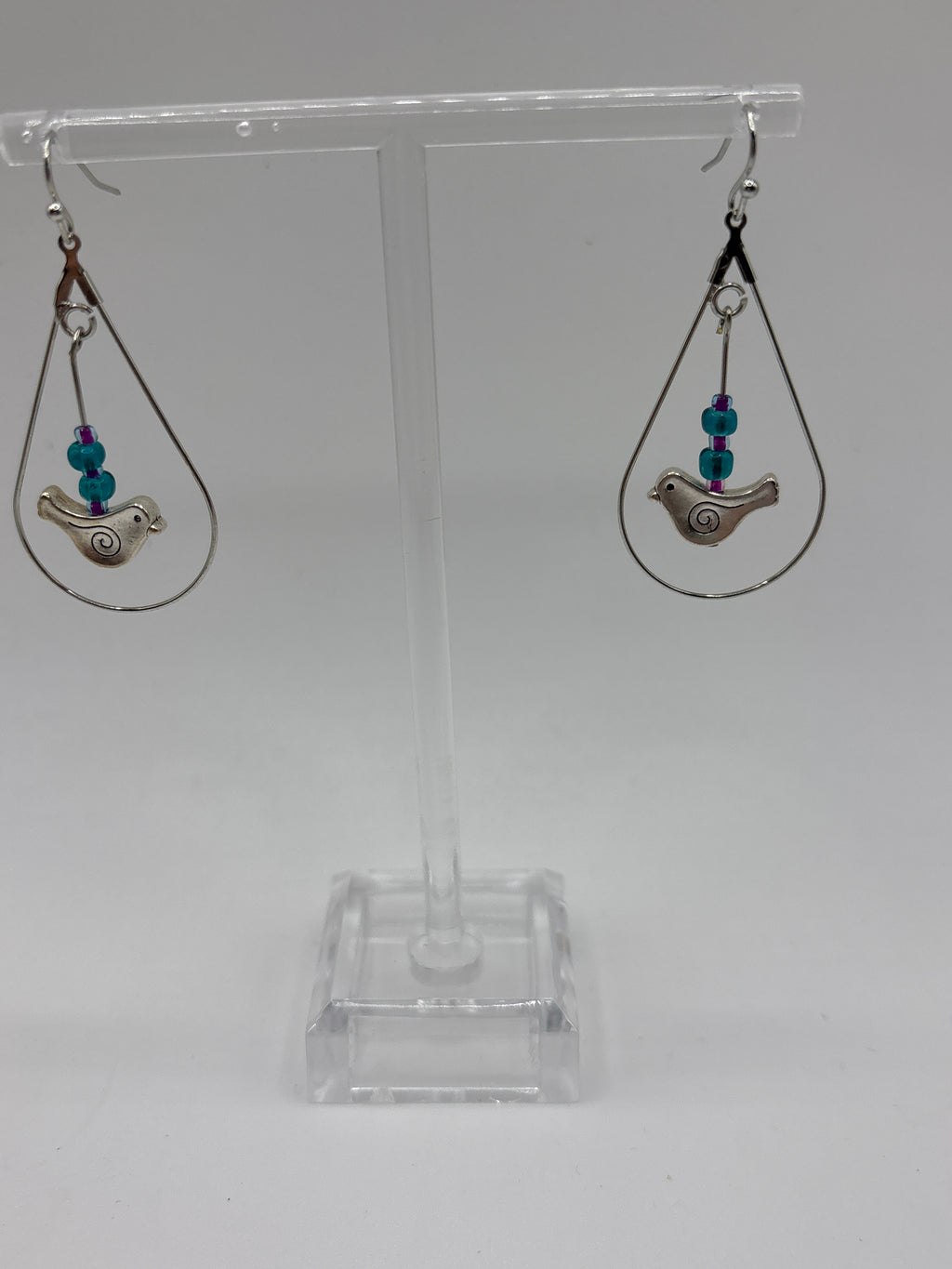 Bird in circle holding glass globe