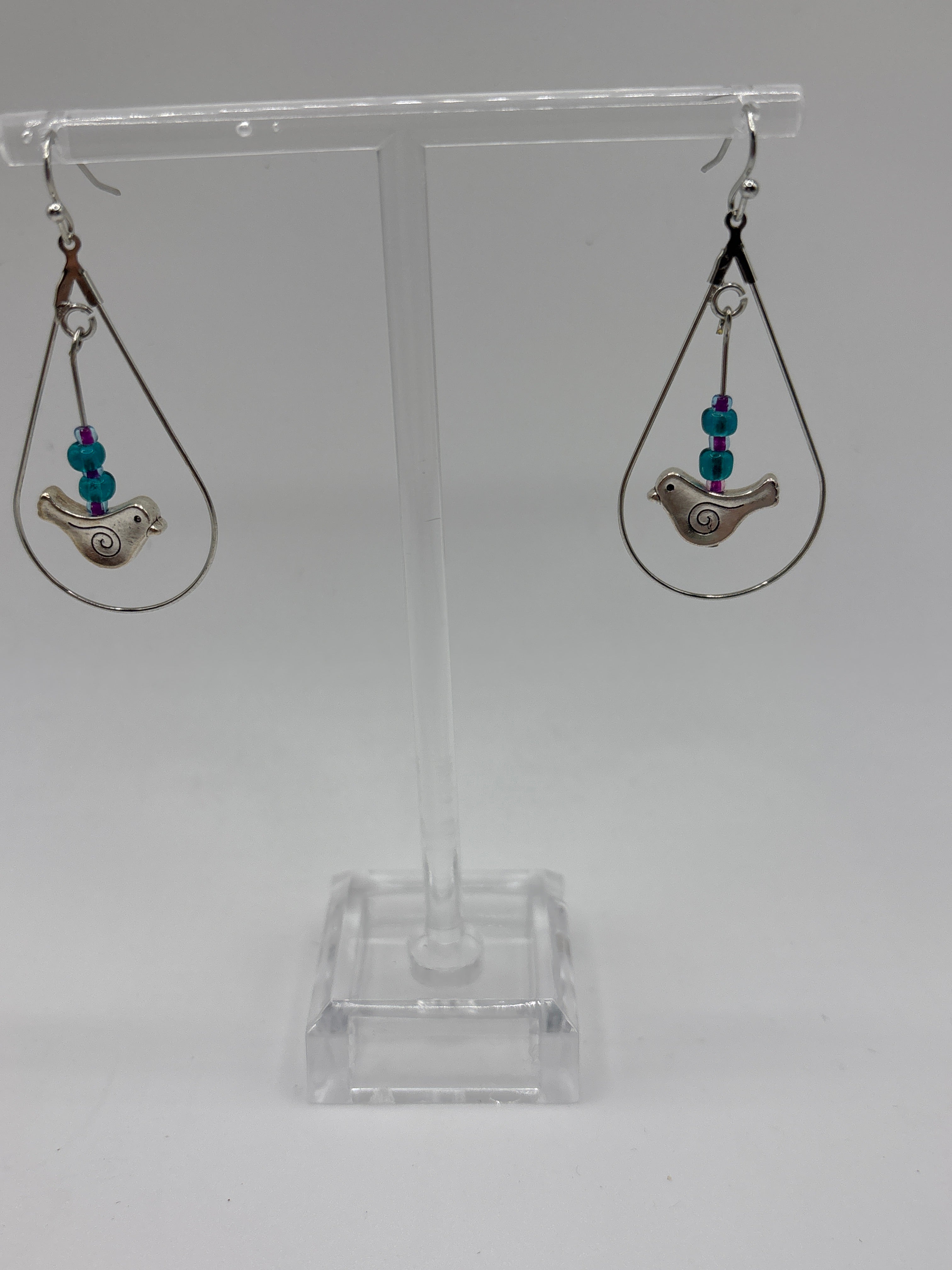 Bird in circle holding glass globe