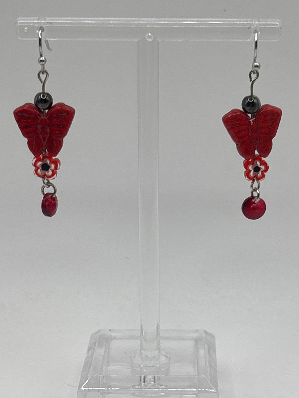 Red butterfly with red flower and dangle