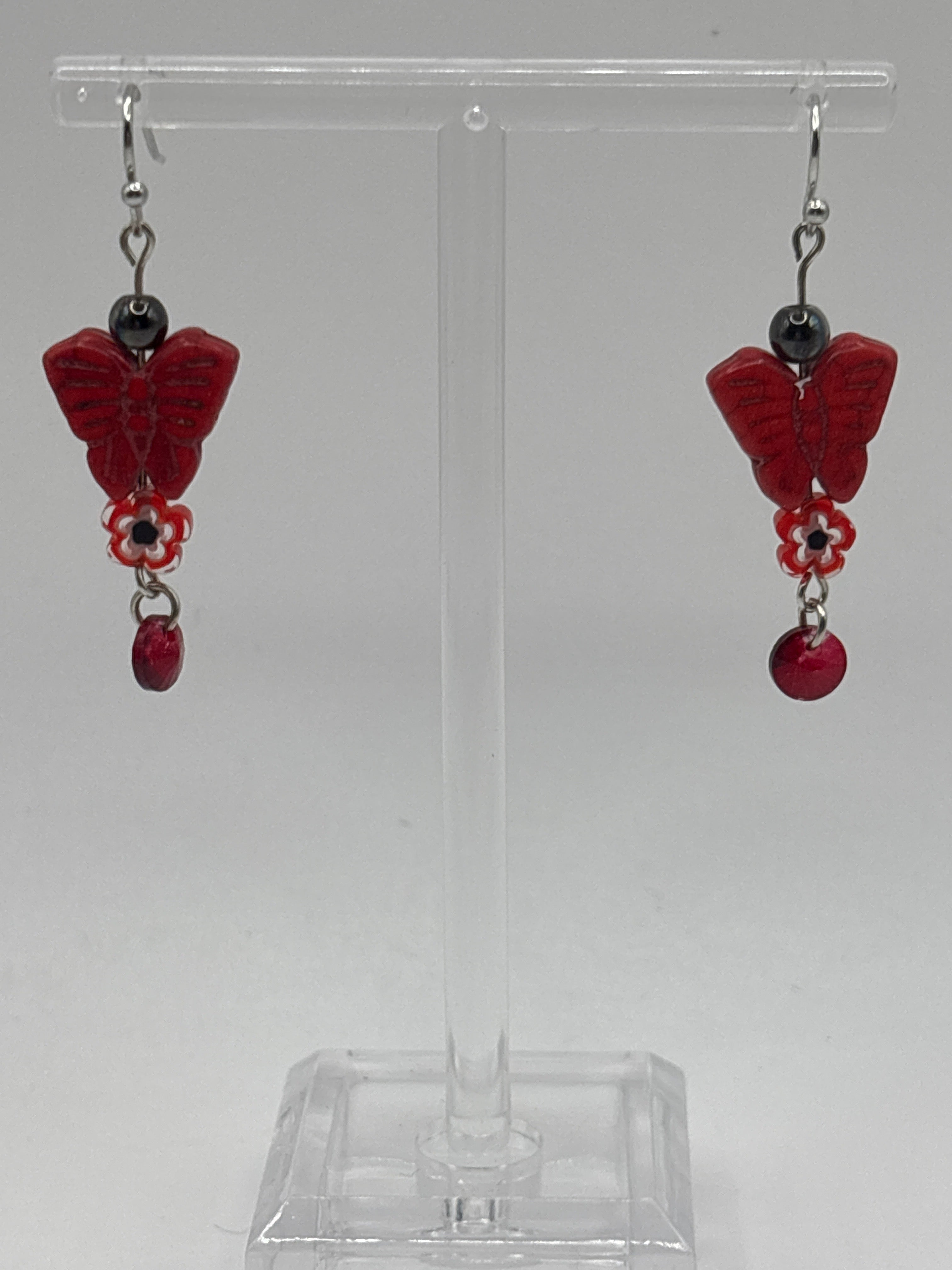 Red butterfly with red flower and dangle