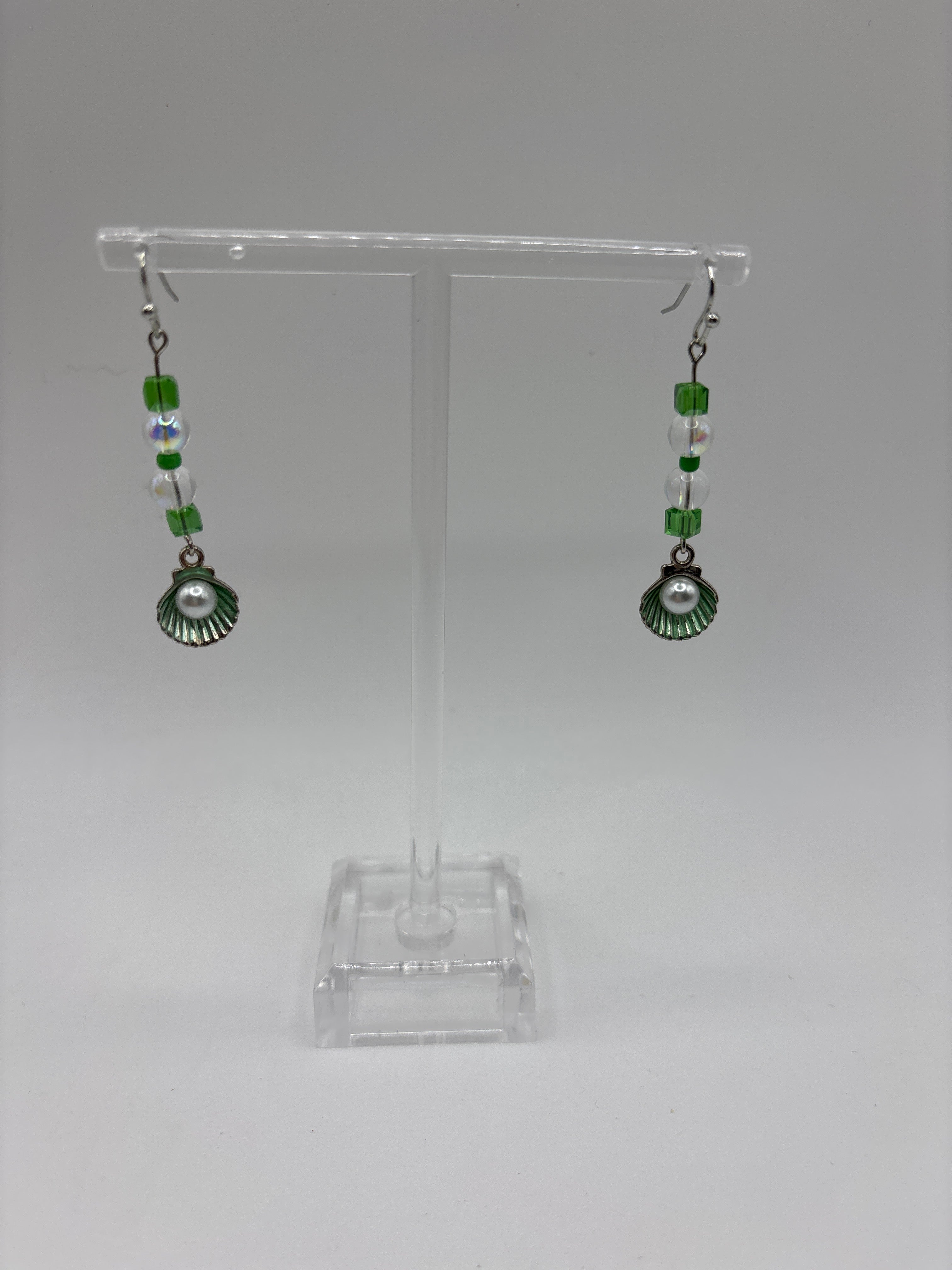 Silver tone with green accent beads, and shell with pearl