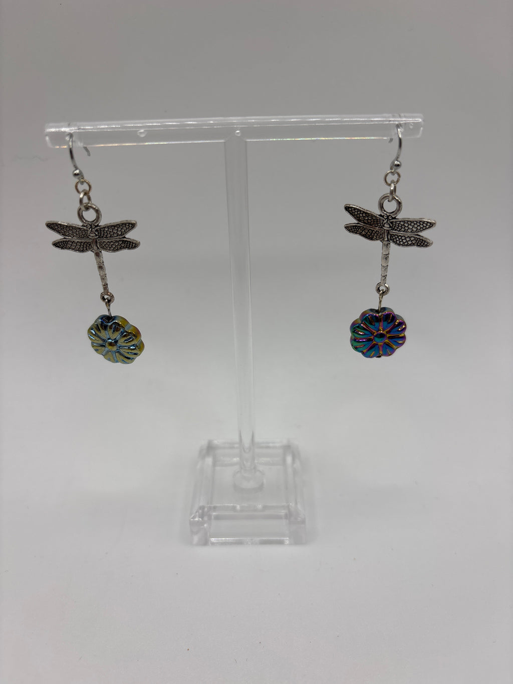 Silver tone dragonfly with iridescent flower