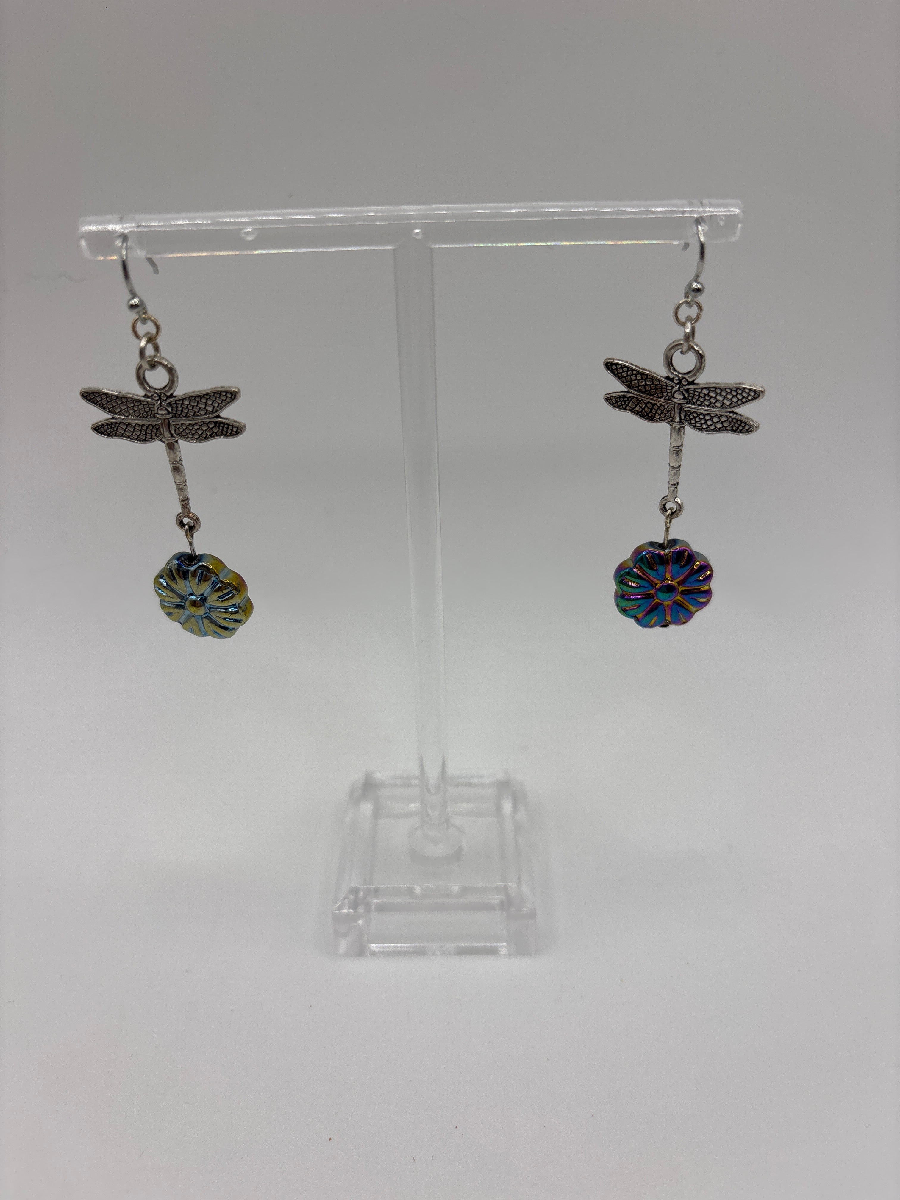 Silver tone dragonfly with iridescent flower