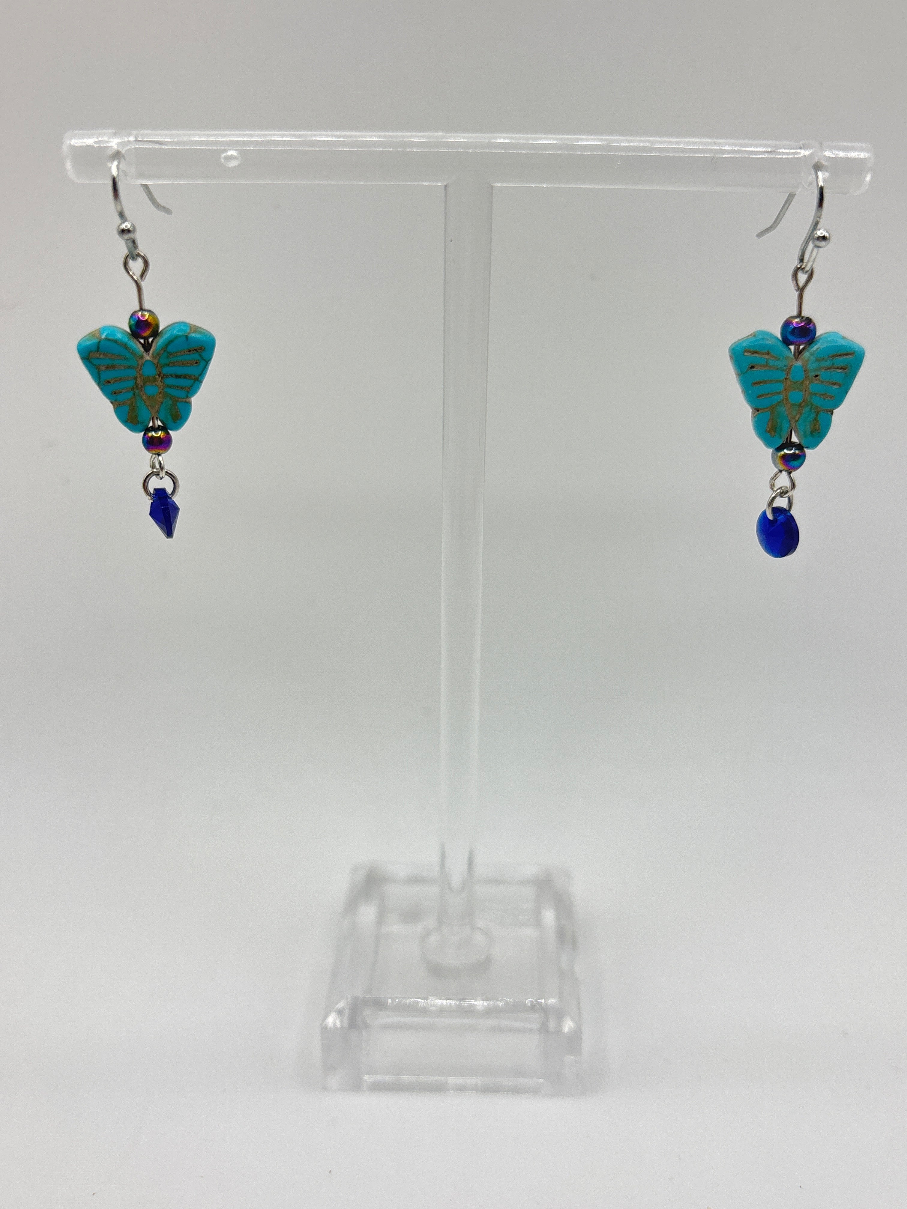 Turquoise small butterfly with iridescent bead