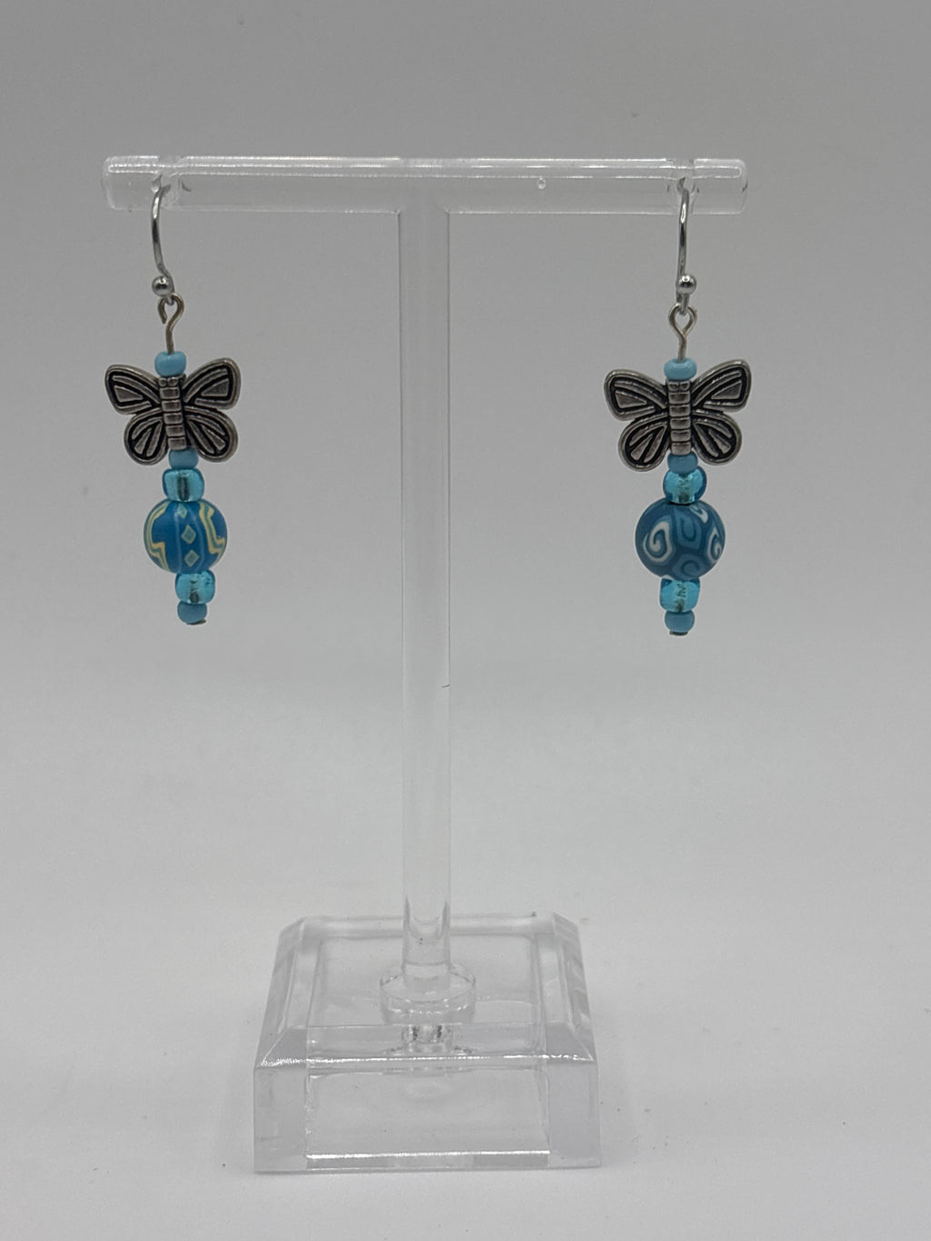 Silver tone butterfly with blue beads