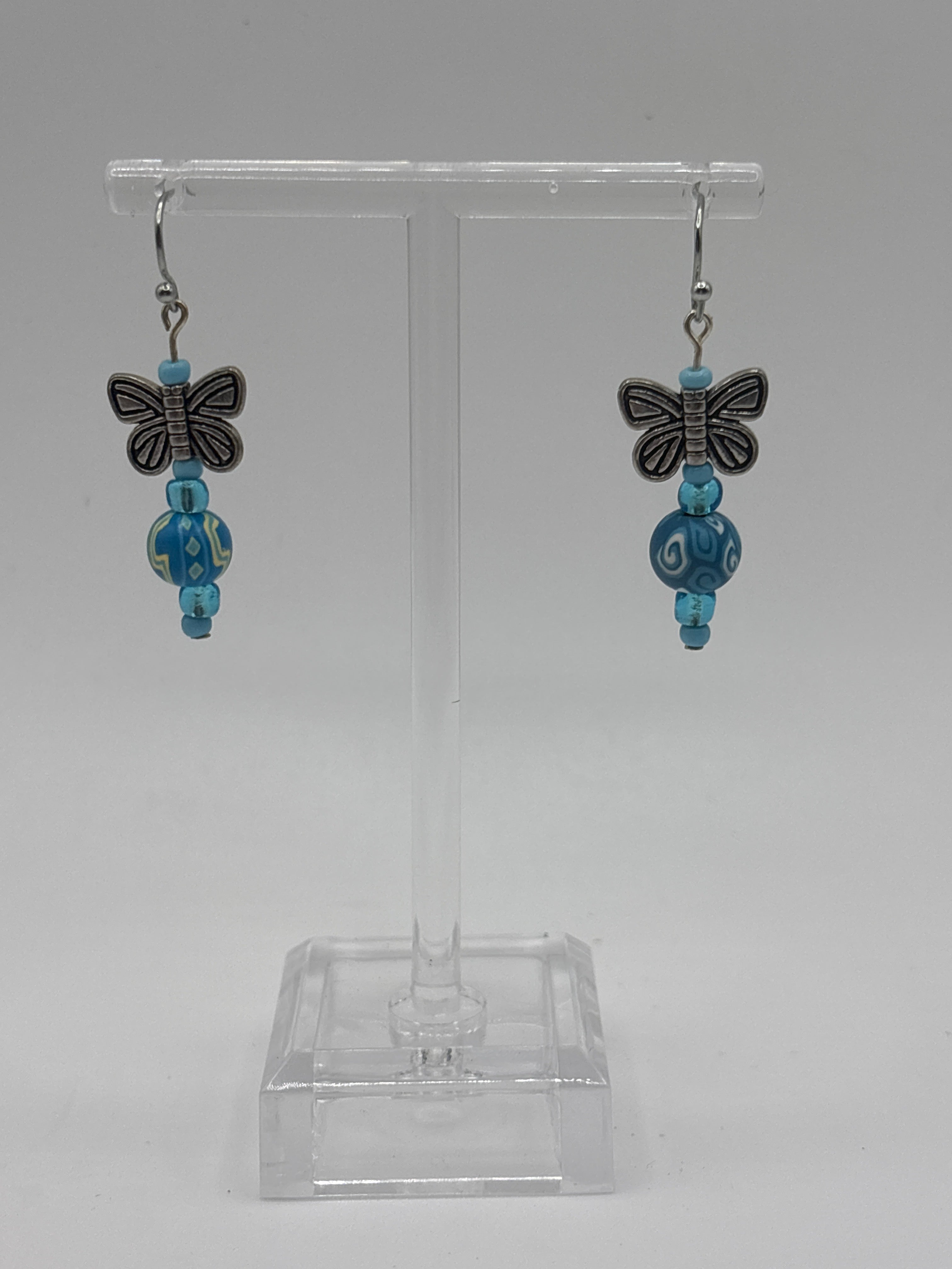 Silver tone butterfly with blue beads