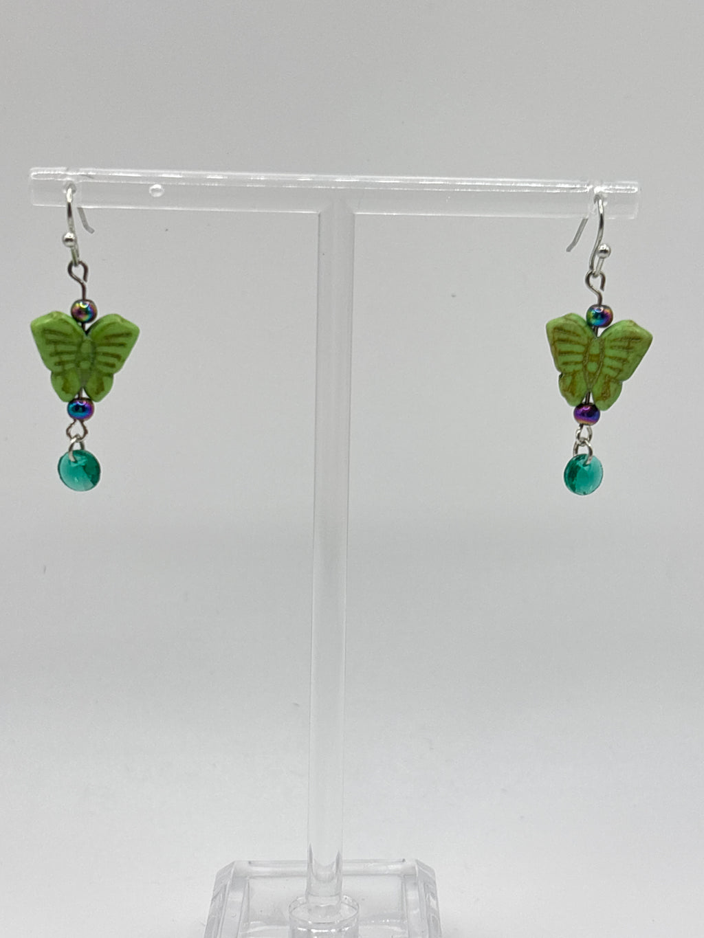 Green butterfly with green dangle