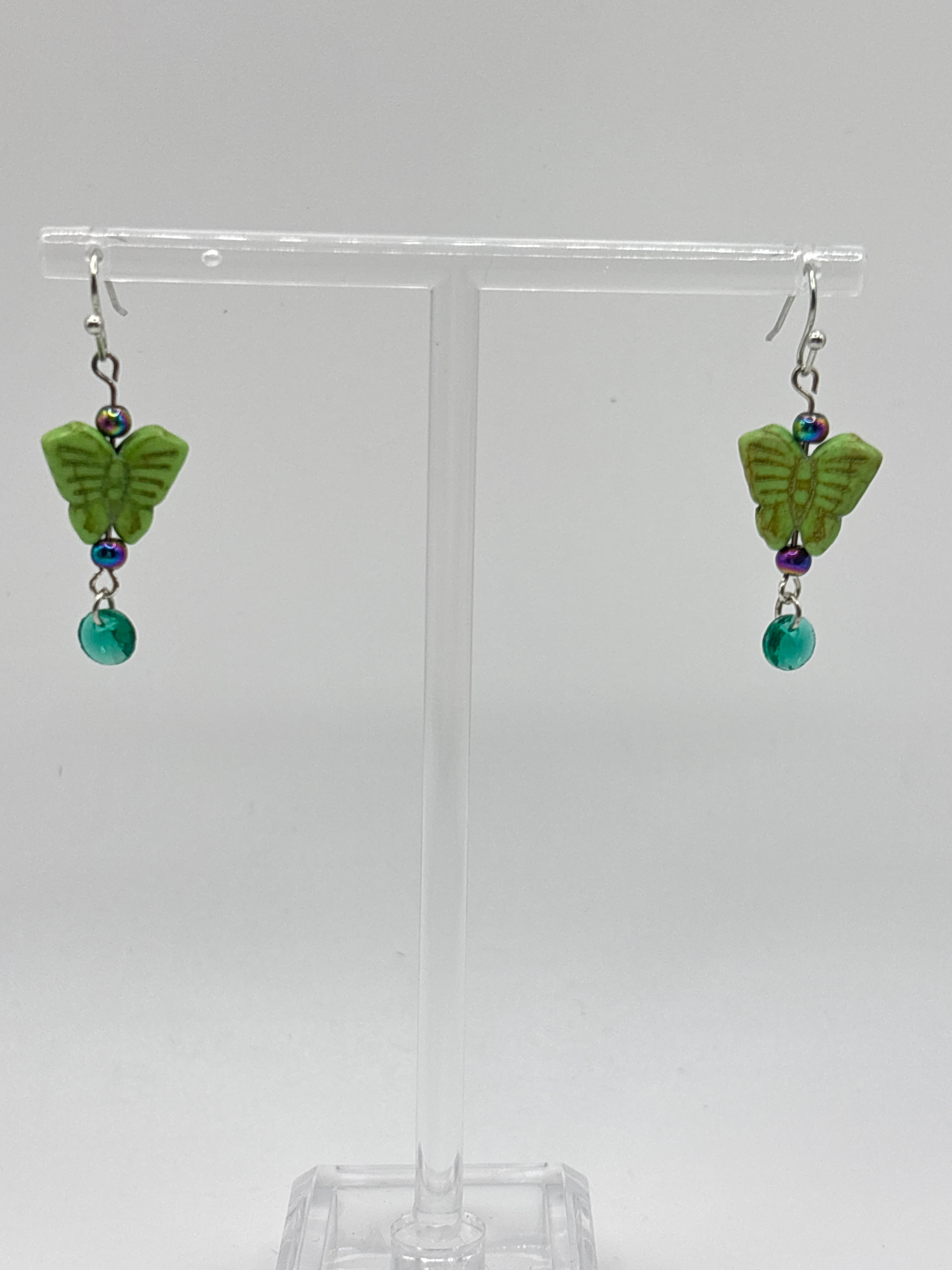 Green butterfly with green dangle