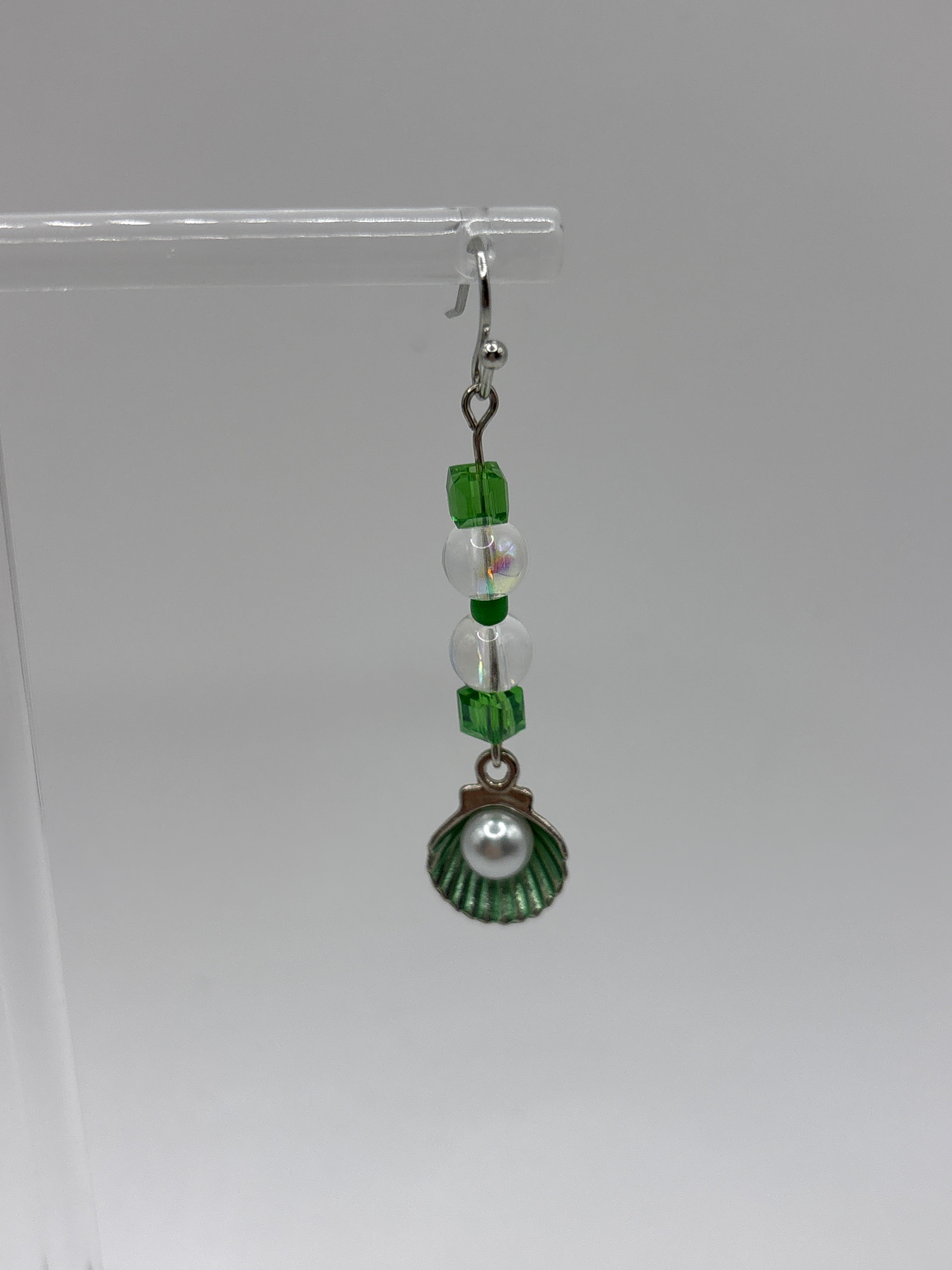 Silver tone with green accent beads, and shell with pearl