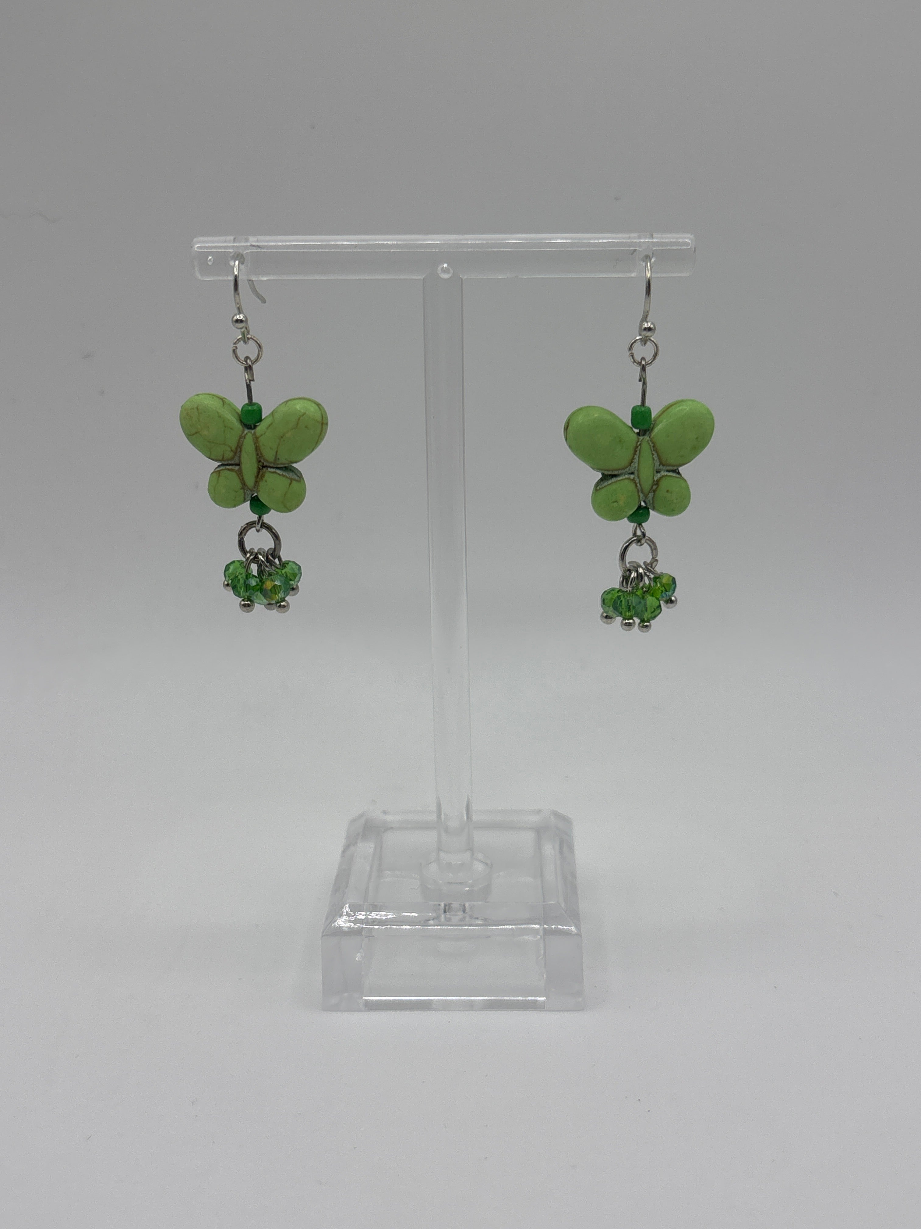 Green butterfly with green dangle crystals
