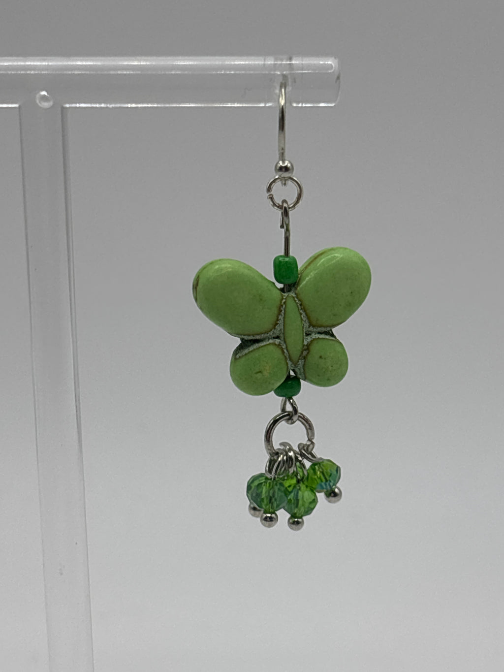 Green butterfly with green dangle crystals