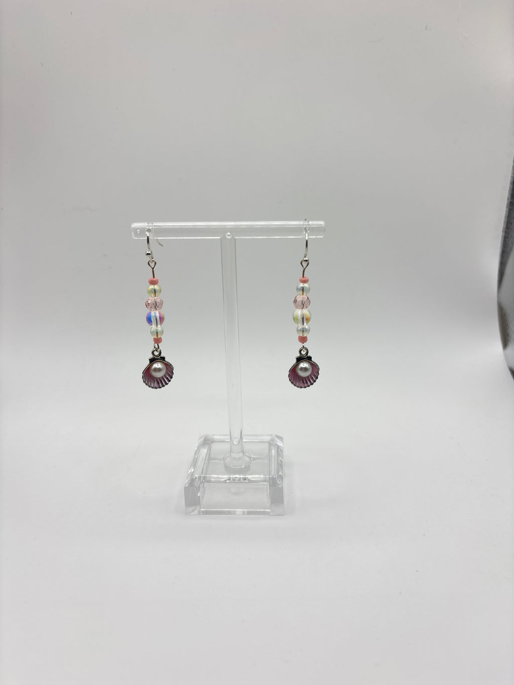 Silver tone shell with pink accents, bubble and pearl