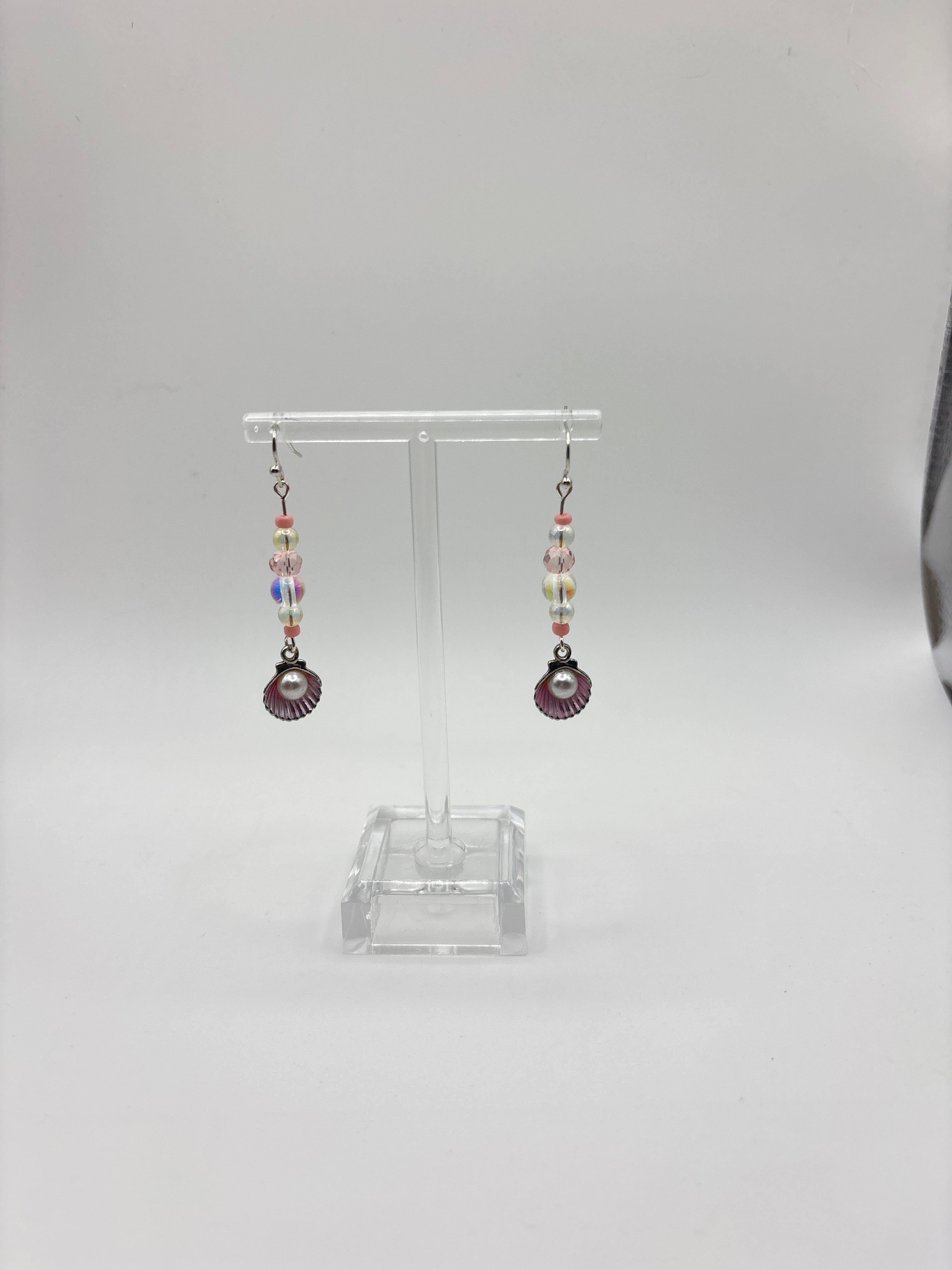 Silver tone shell with pink accents, bubble and pearl