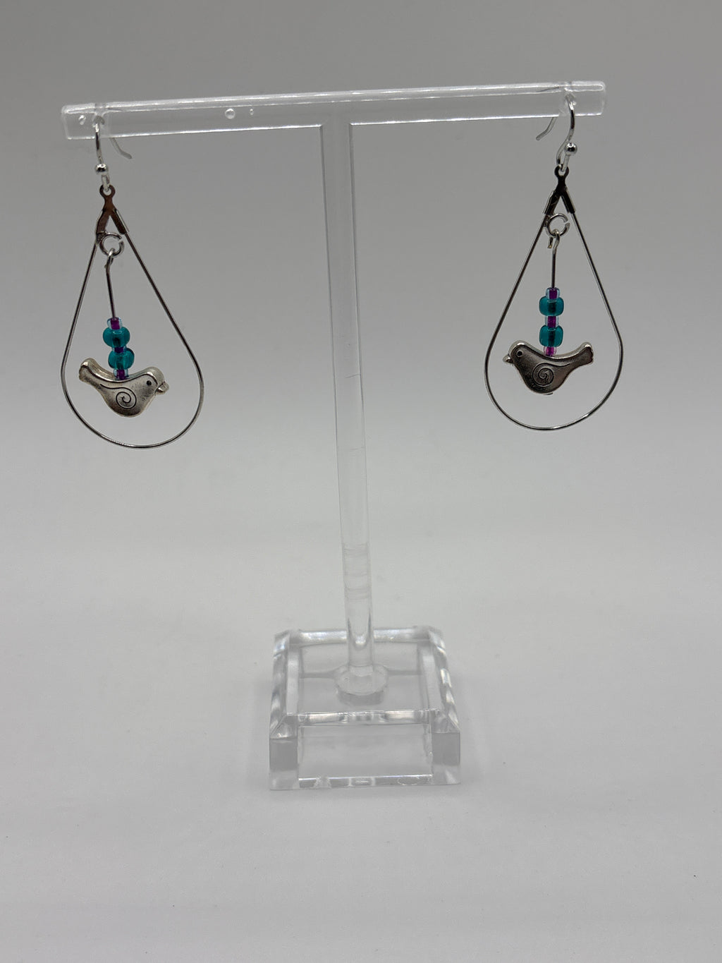 Bird in circle holding glass globe