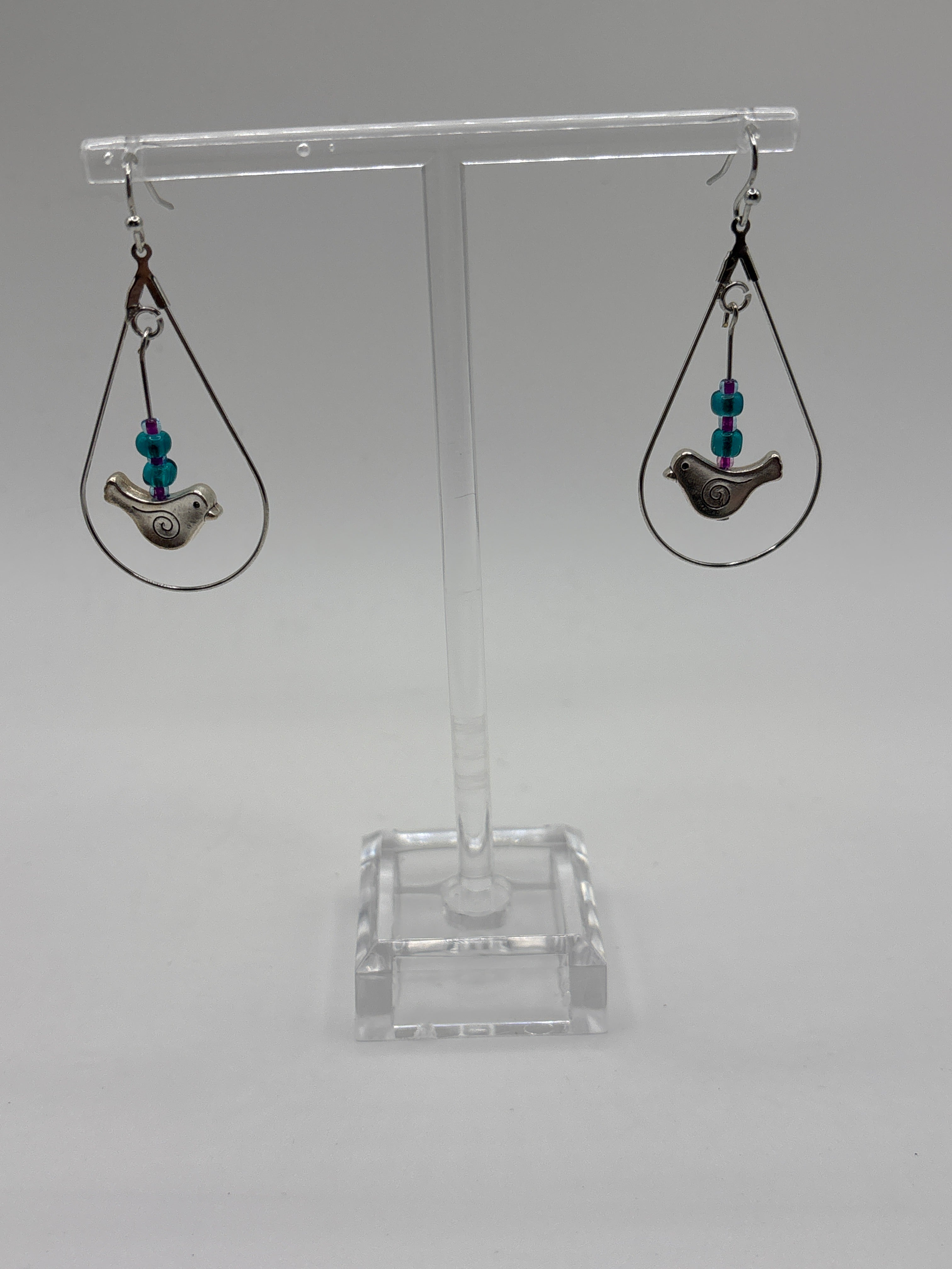 Bird in circle holding glass globe