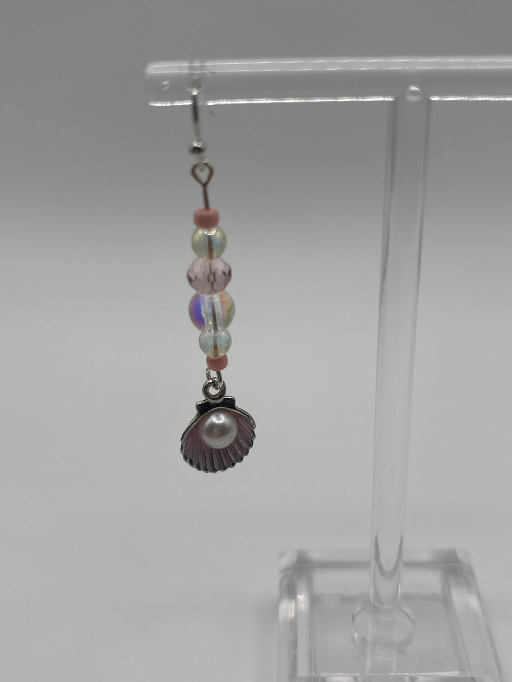 Silver tone shell with pink accents, bubble and pearl