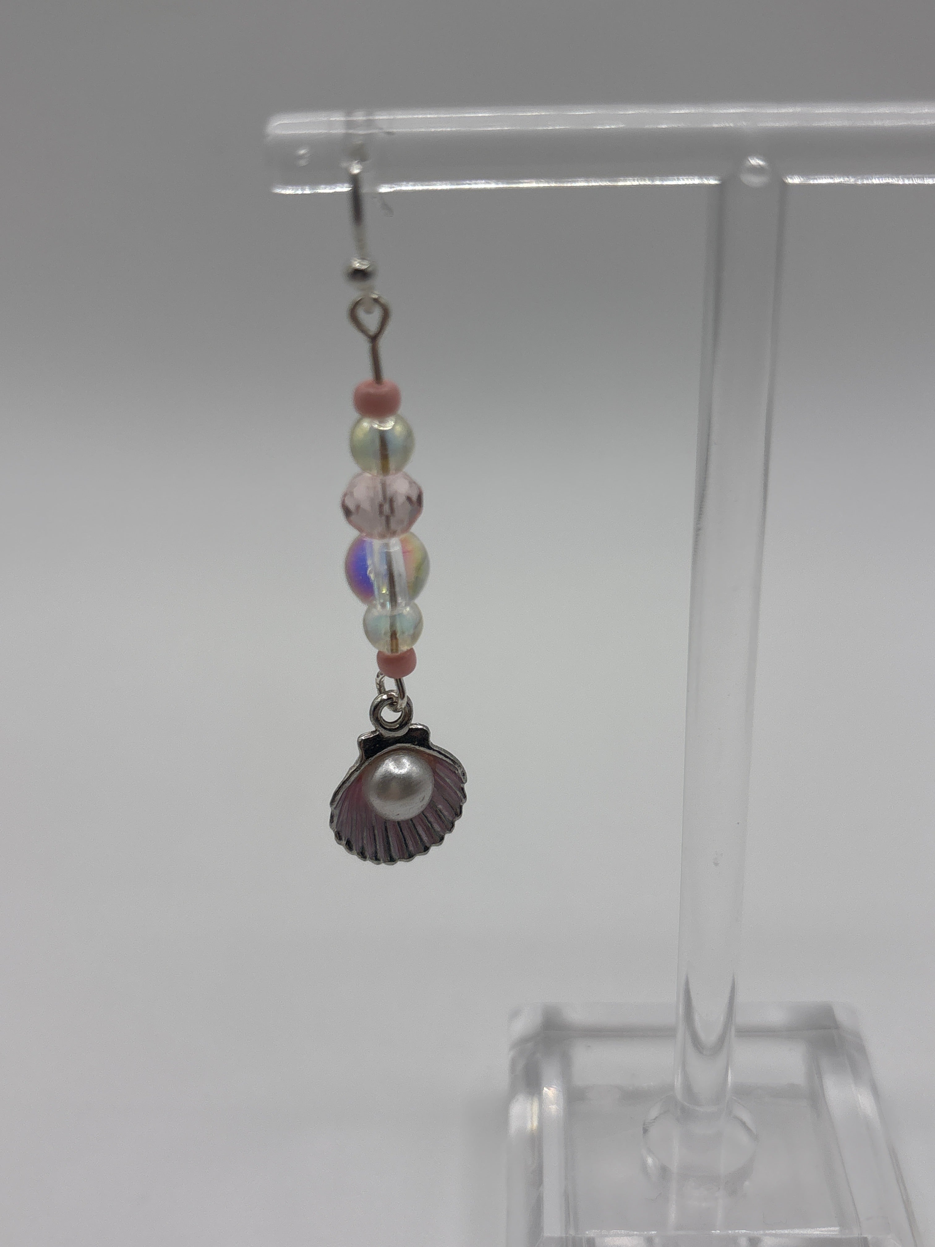 Silver tone shell with pink accents, bubble and pearl