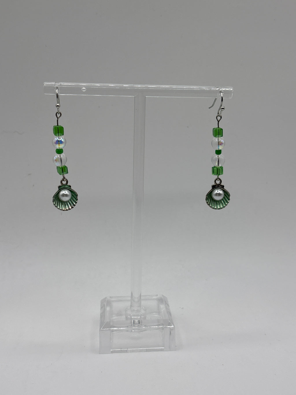 Silver tone with green accent beads, and shell with pearl