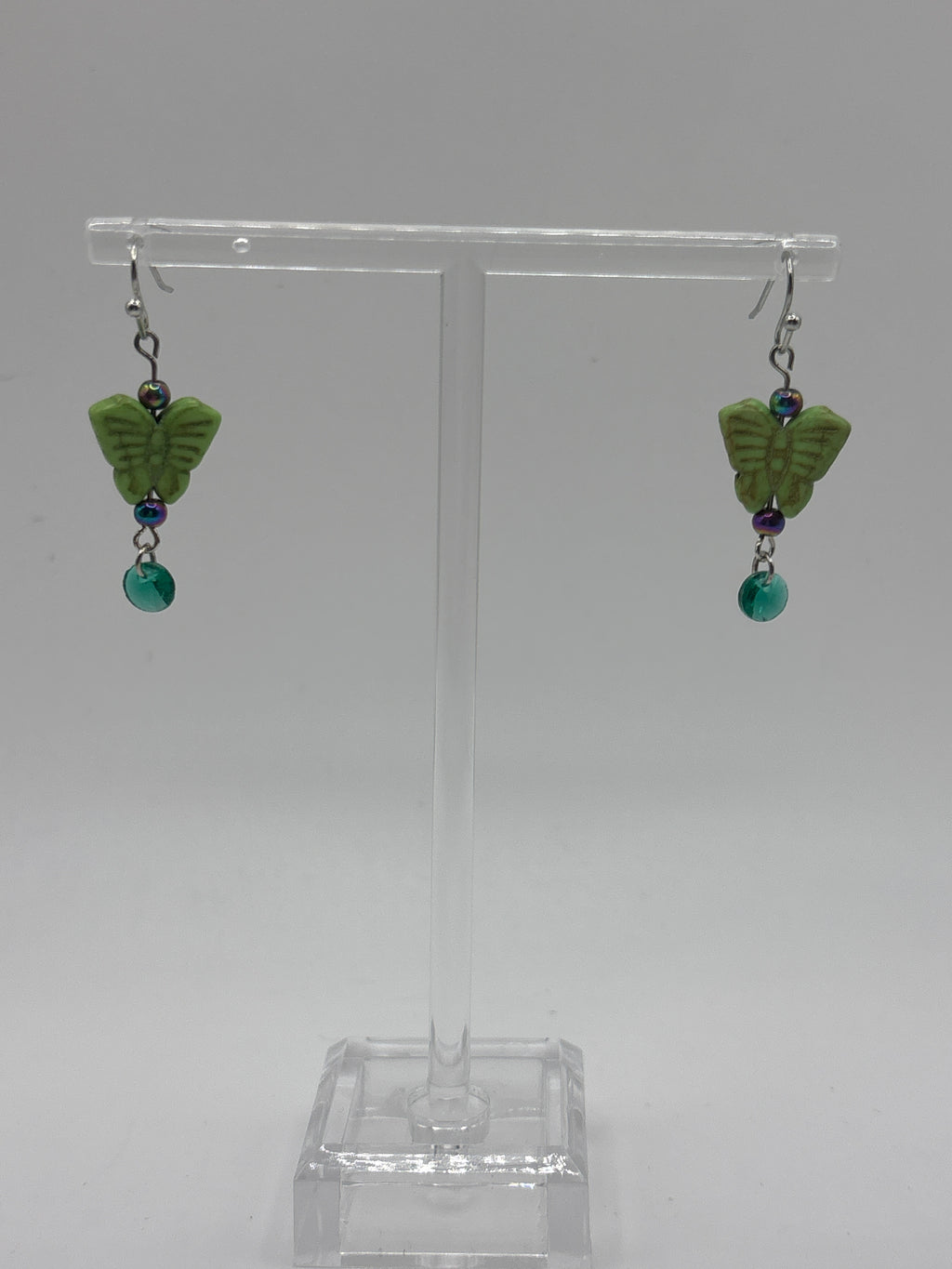 Green butterfly with green dangle