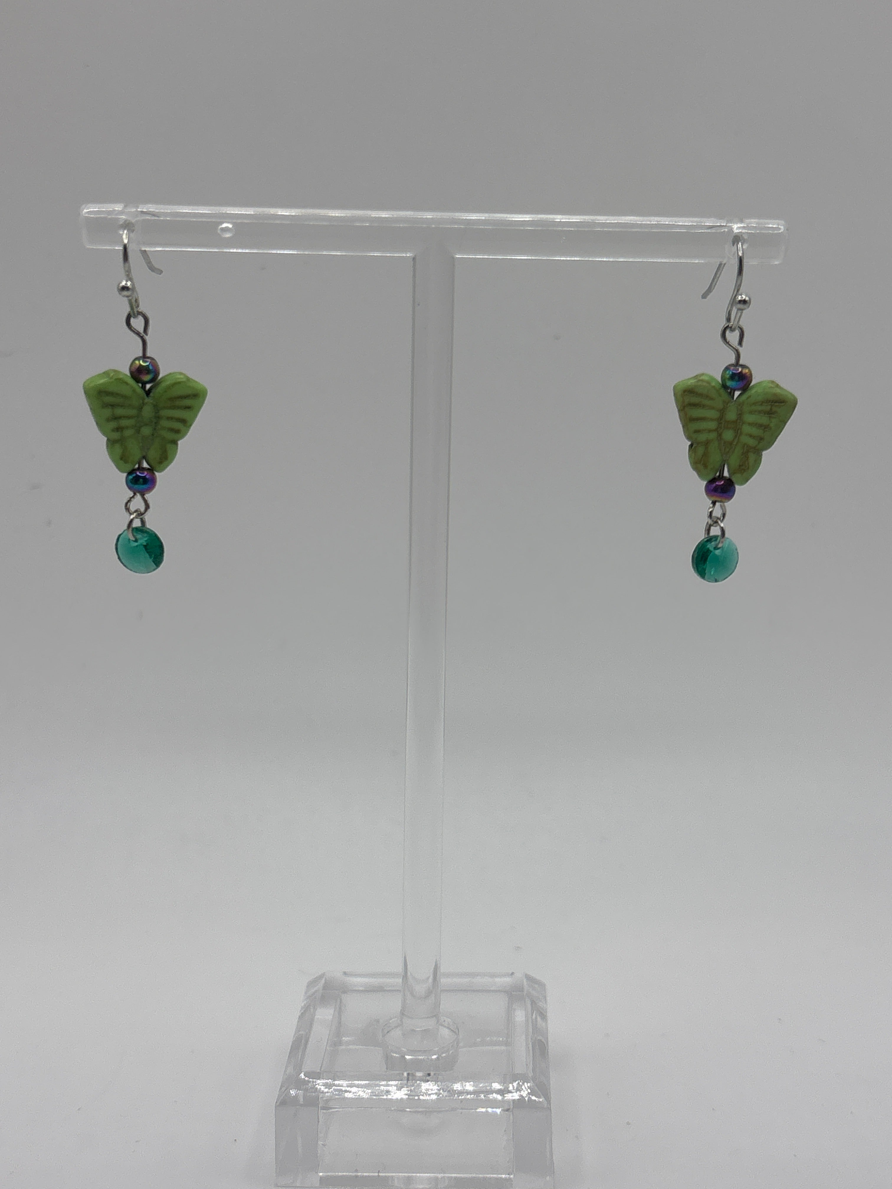 Green butterfly with green dangle