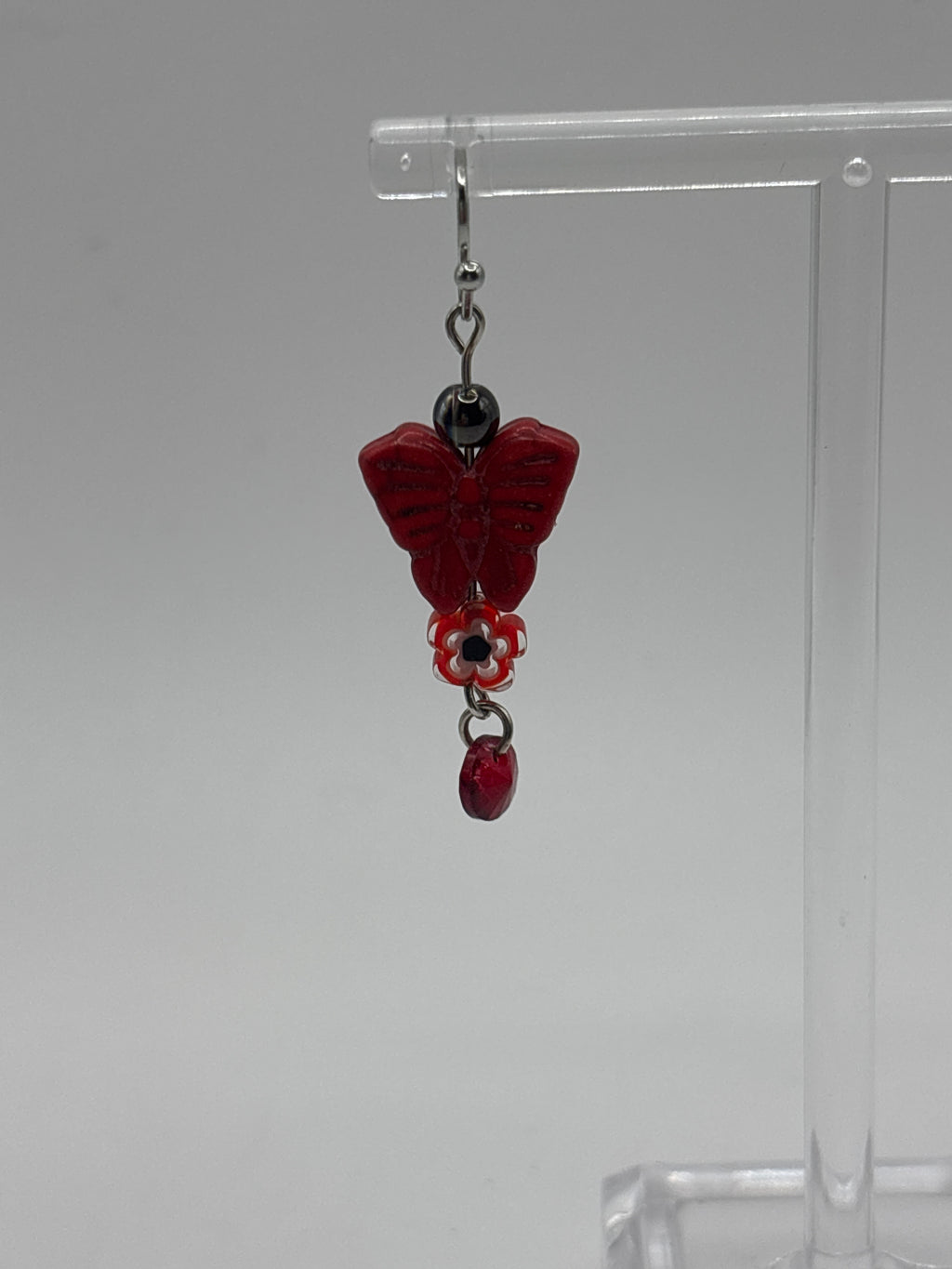 Red butterfly with red flower and dangle