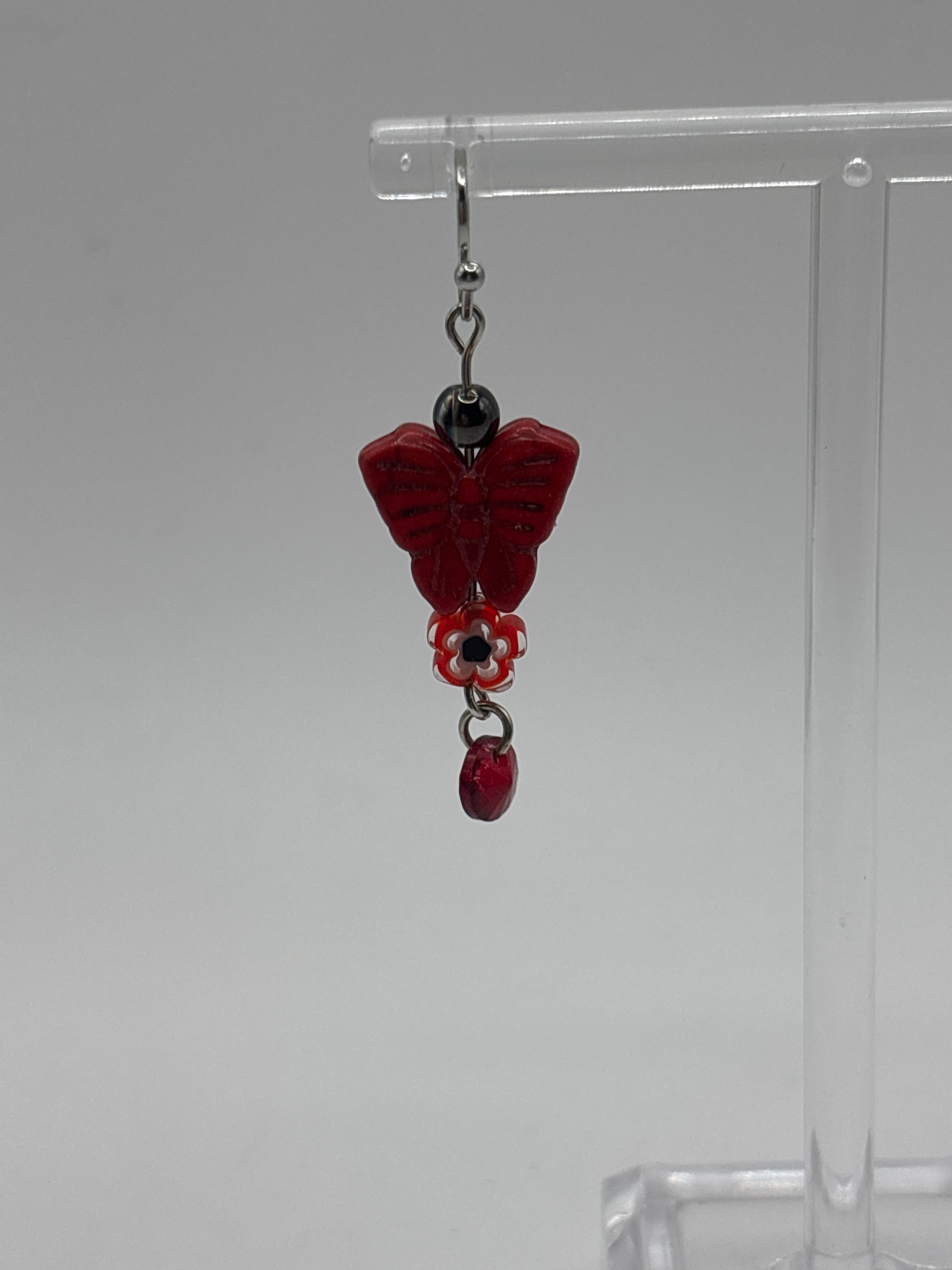 Red butterfly with red flower and dangle
