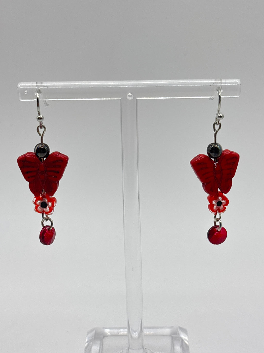 Red butterfly with red flower and dangle