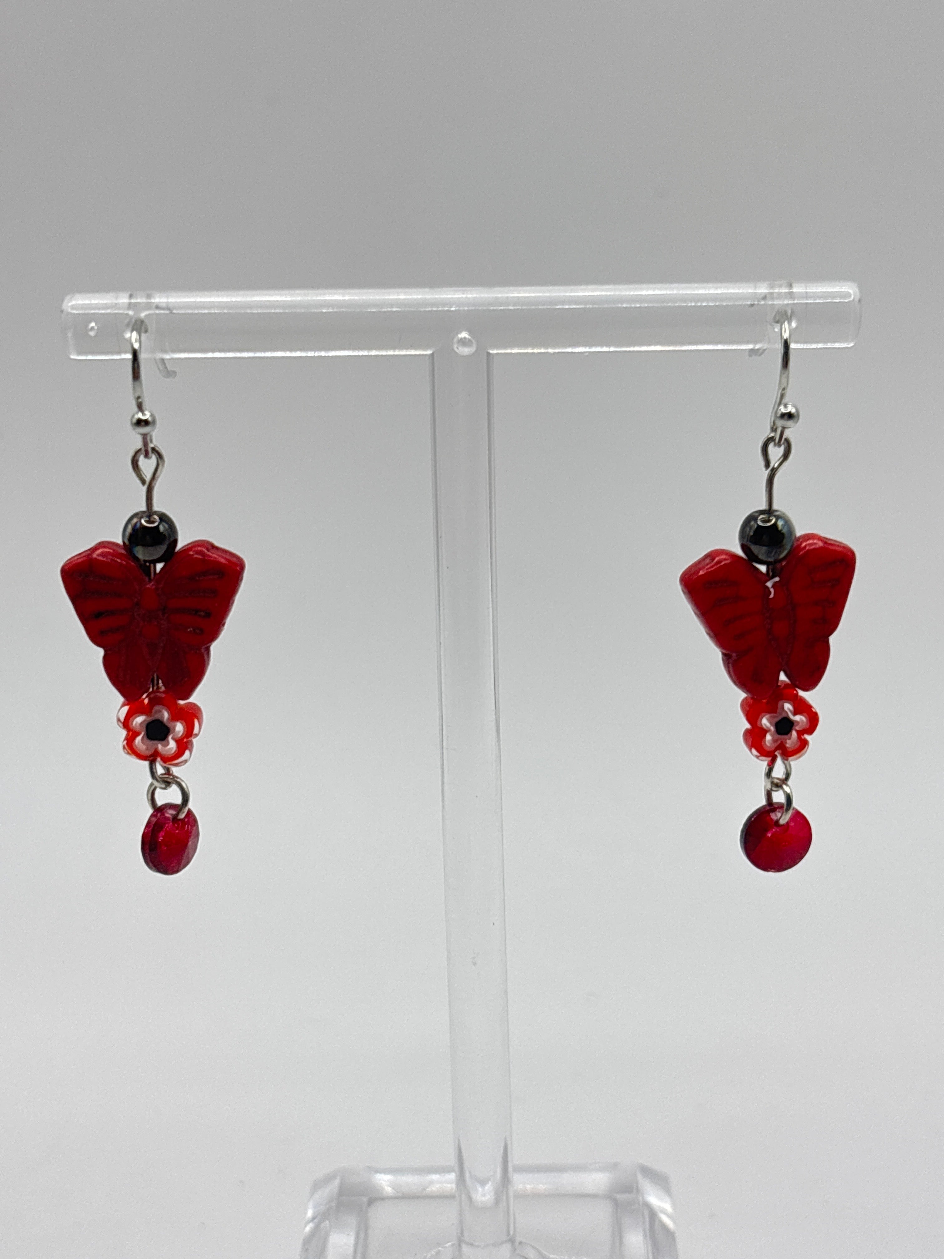 Red butterfly with red flower and dangle