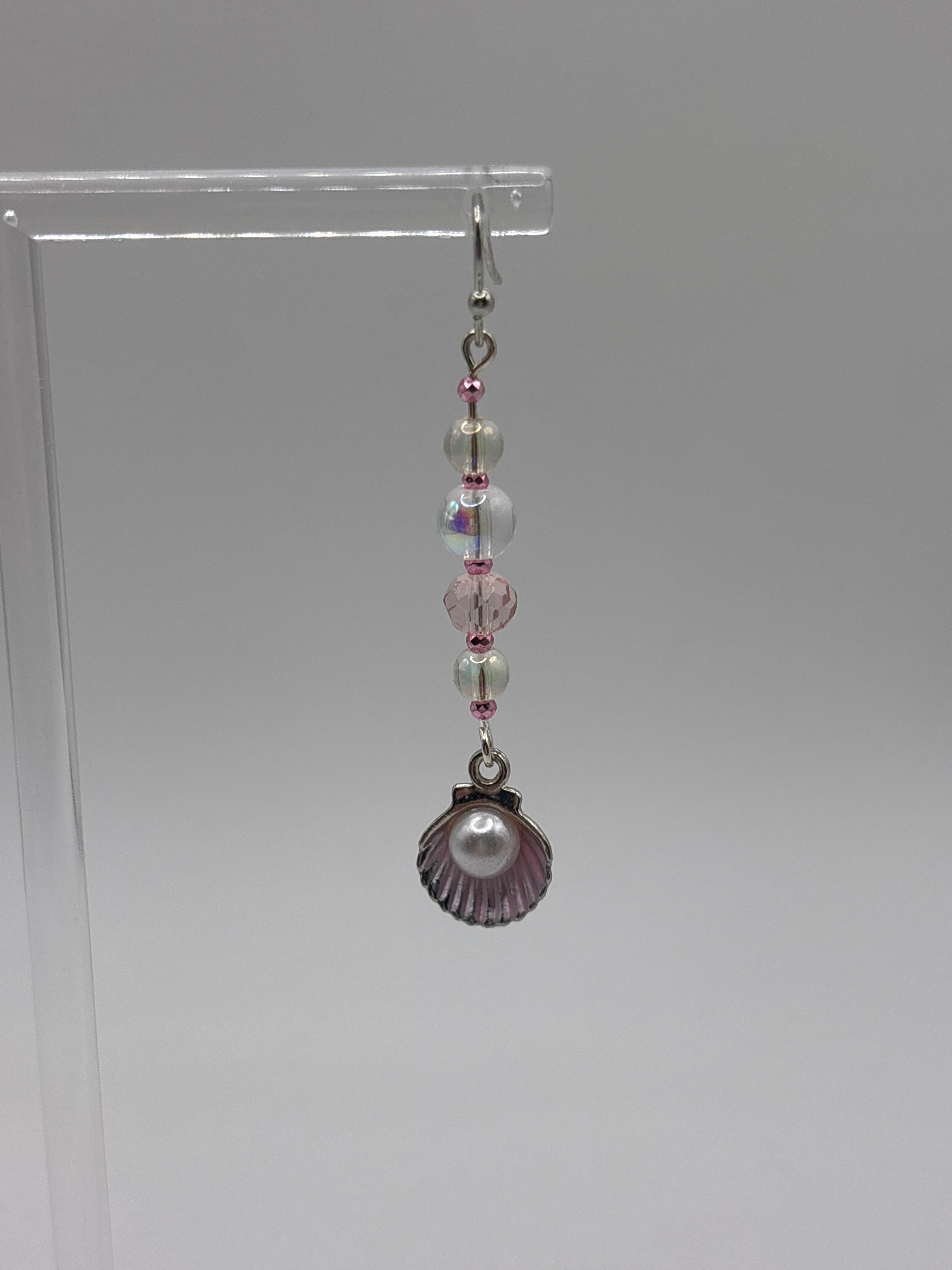 Pink shell with silver tone, pearl, bubbles and crystal.