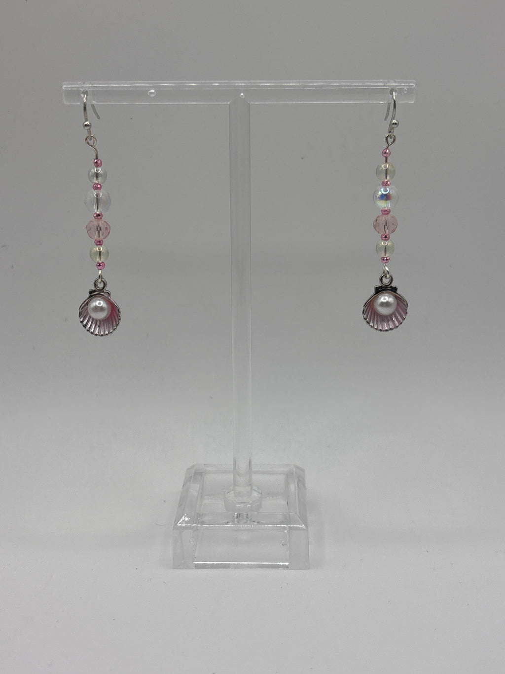 Pink shell with silver tone, pearl, bubbles and crystal.