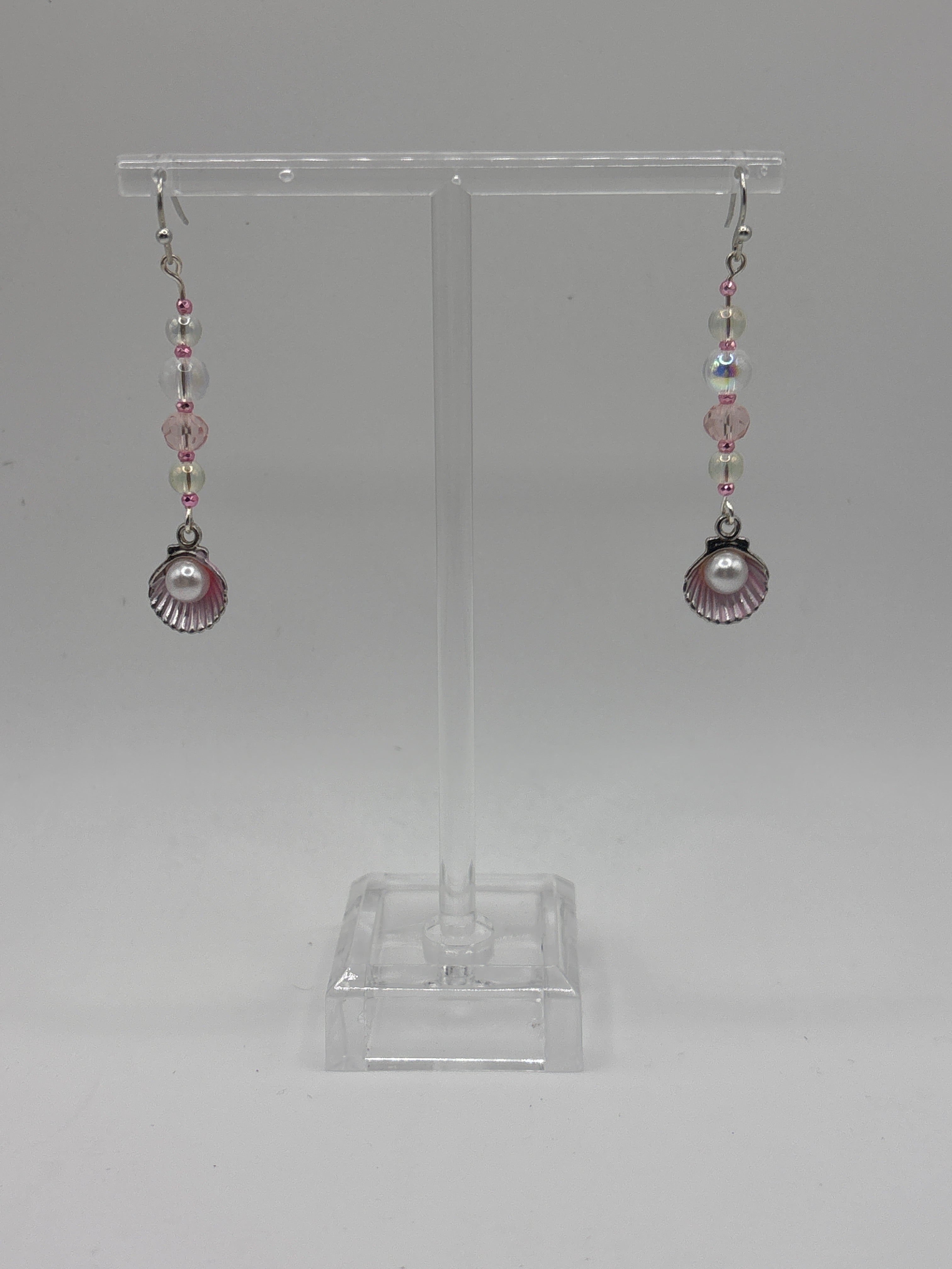 Pink shell with silver tone, pearl, bubbles and crystal.