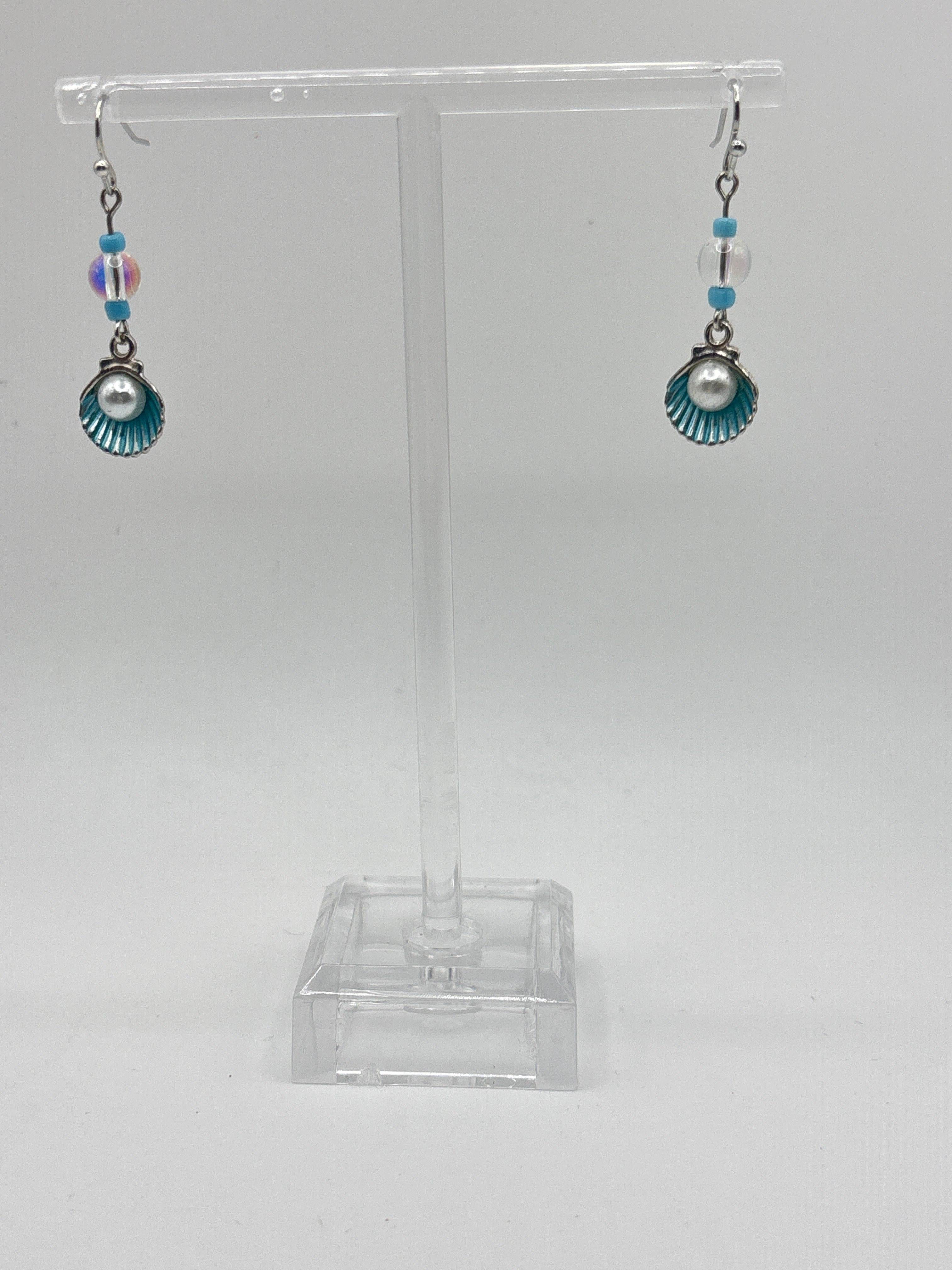 Silver tone shell with blue accents and pearl