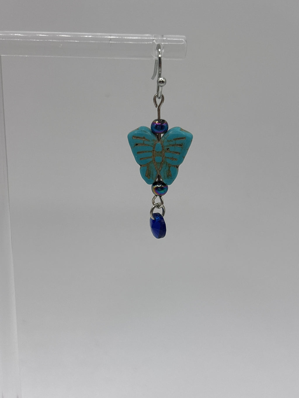 Turquoise small butterfly with iridescent bead