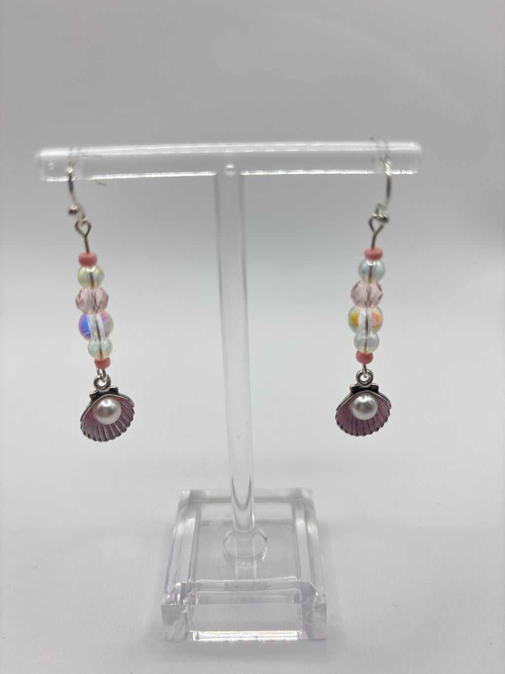 Silver tone shell with pink accents, bubble and pearl