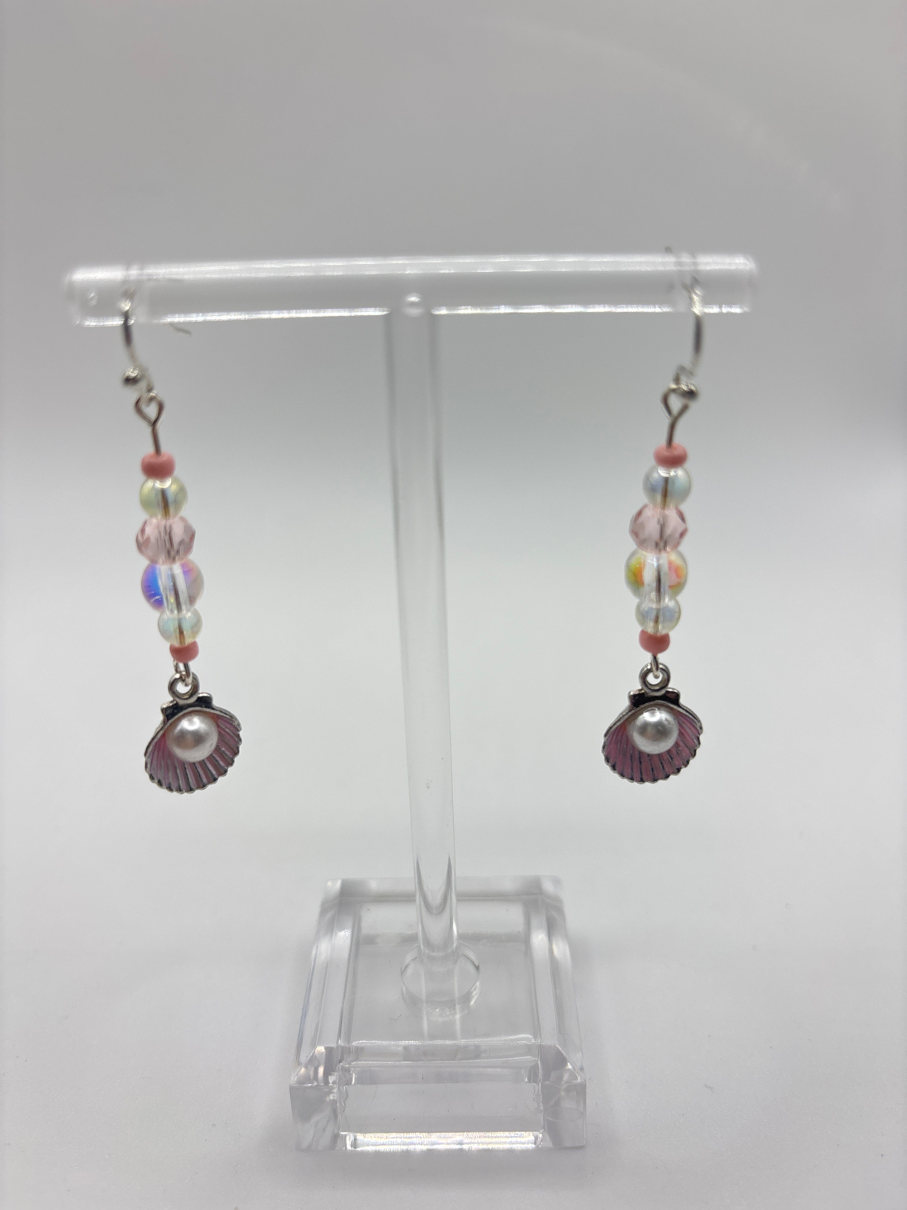 Silver tone shell with pink accents, bubble and pearl