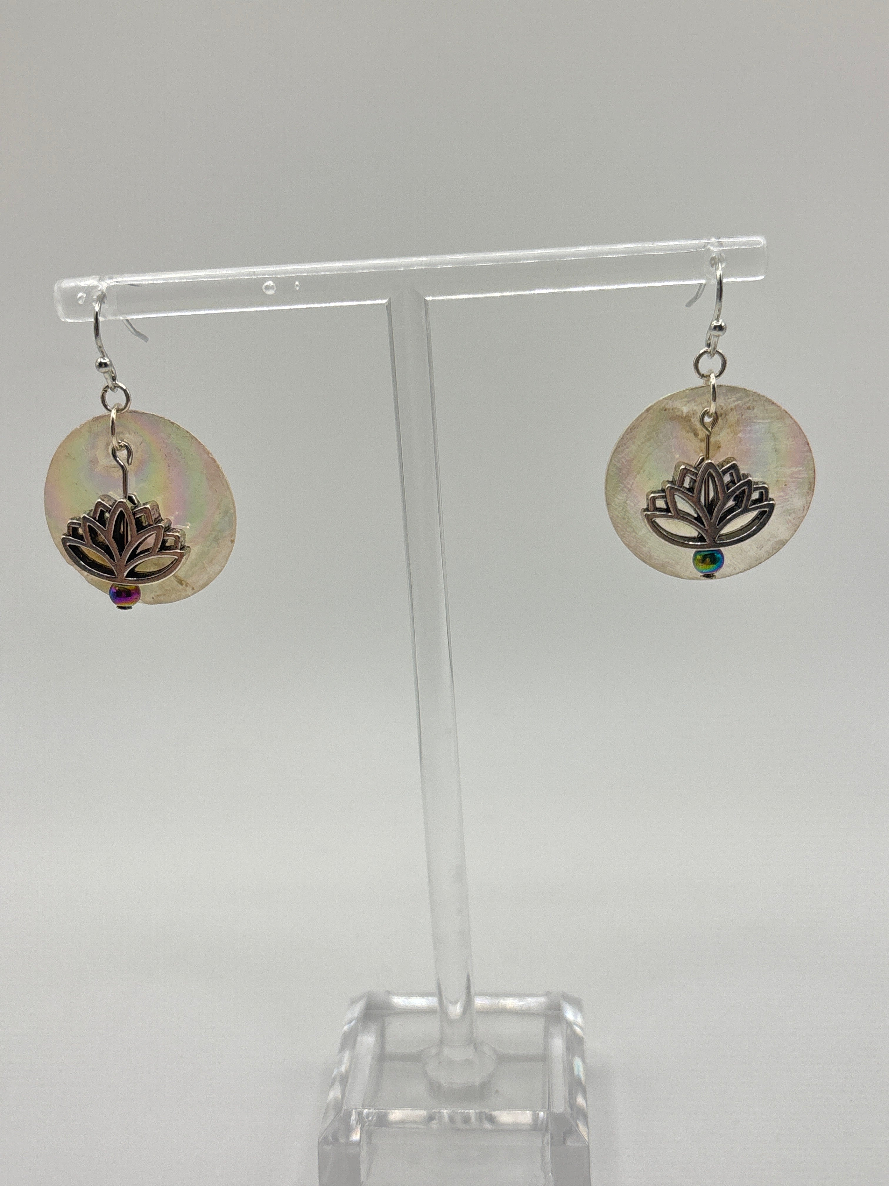 Silver tone lotus flower on iridescent shell