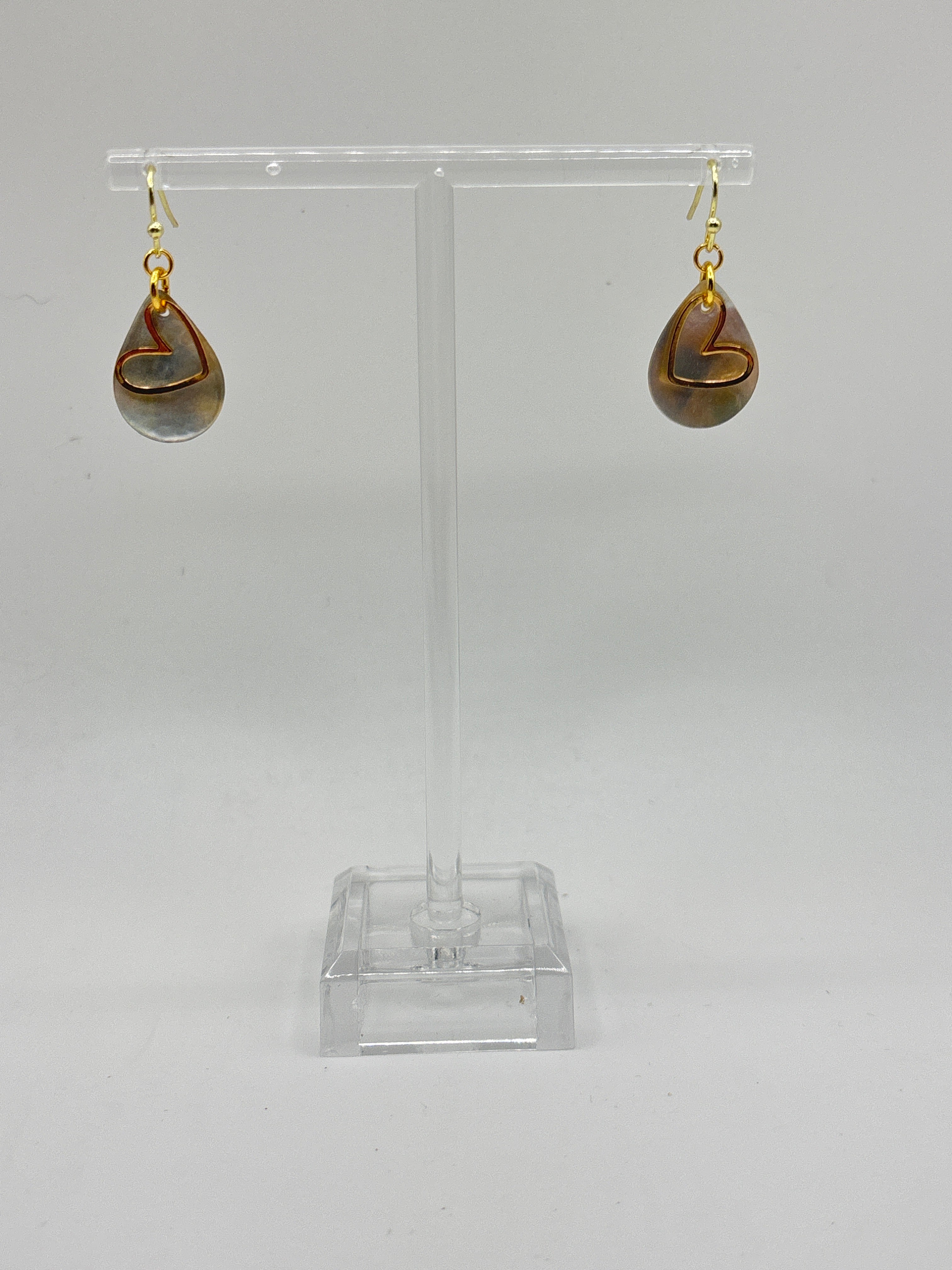 Teardrop white shell with gold tone heart