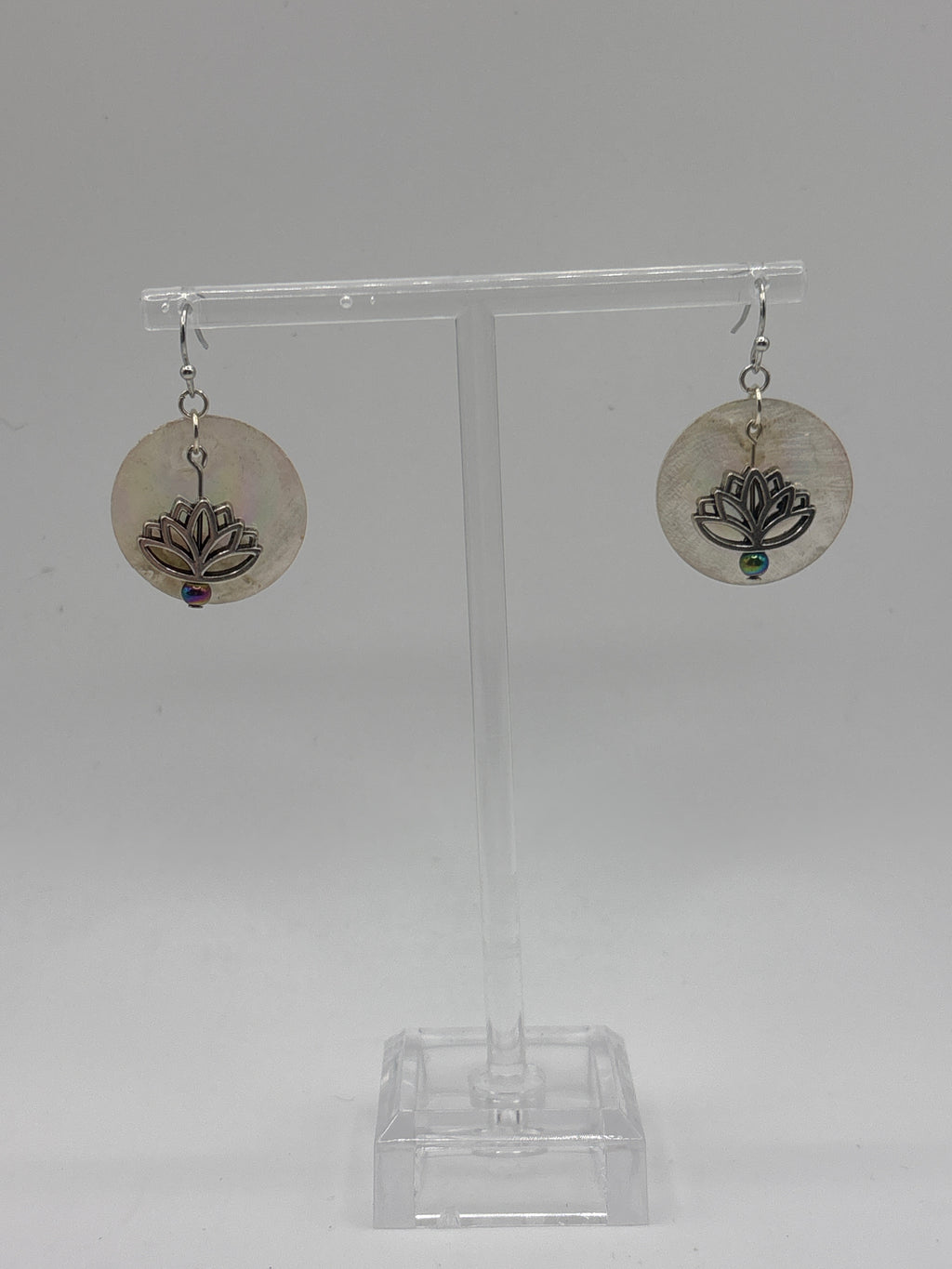Silver tone lotus flower on iridescent shell